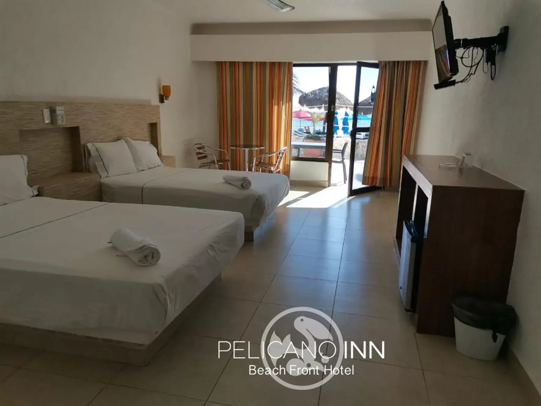 Photo of the whole room in Pelicano Inn Playa del Carmen - Beachfront Hotel