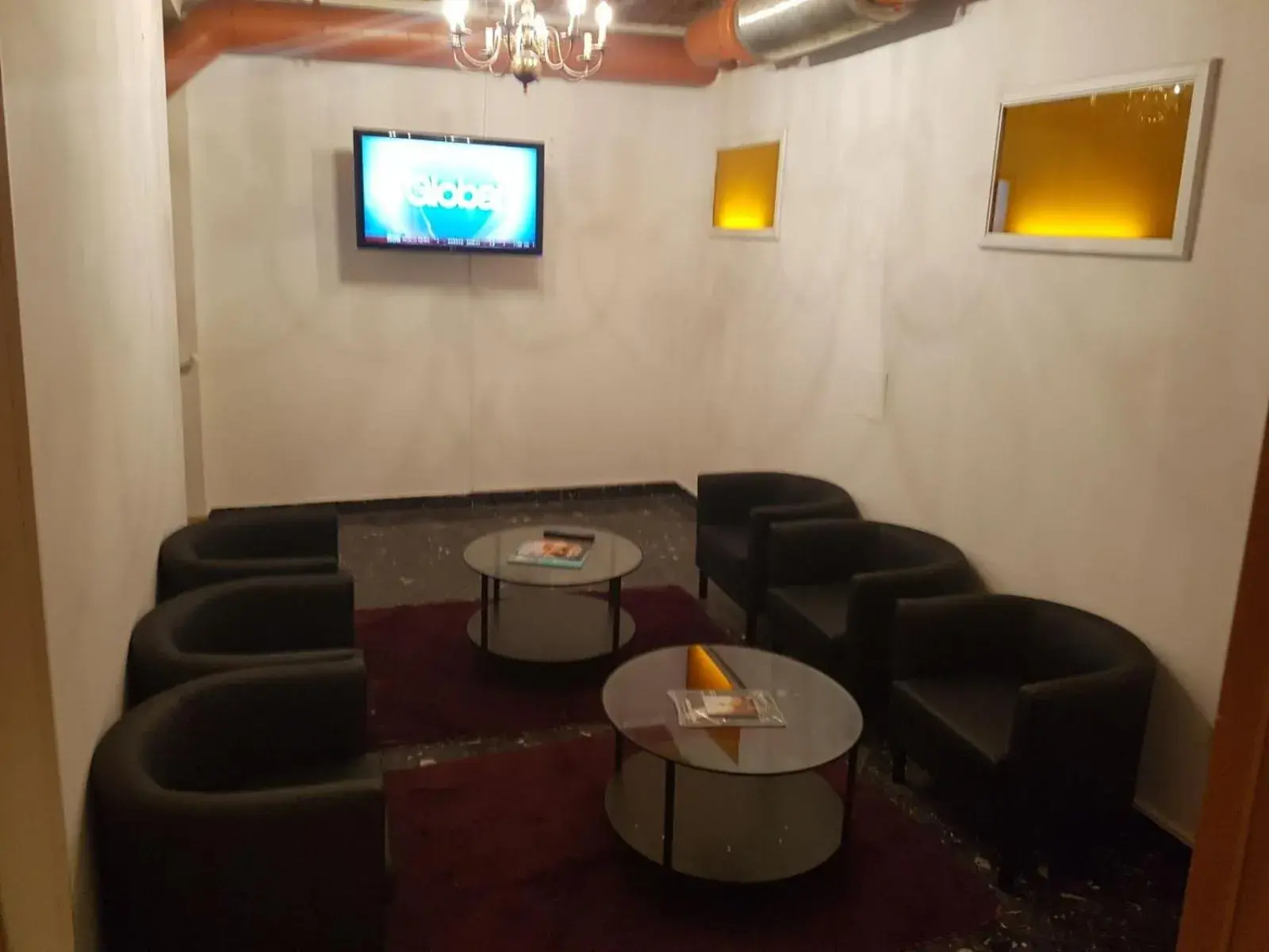 Communal lounge/ TV room, Seating Area in Hotel Carina