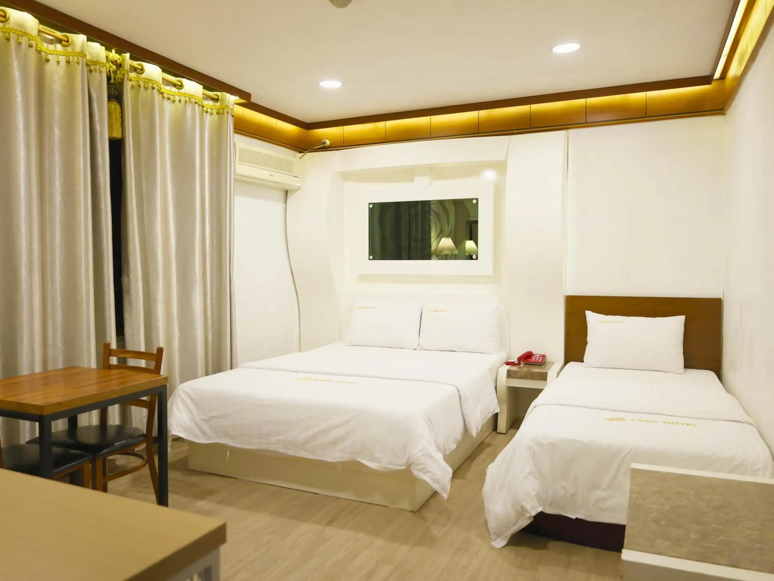 Bed in Goodstay Andong Park Hotel