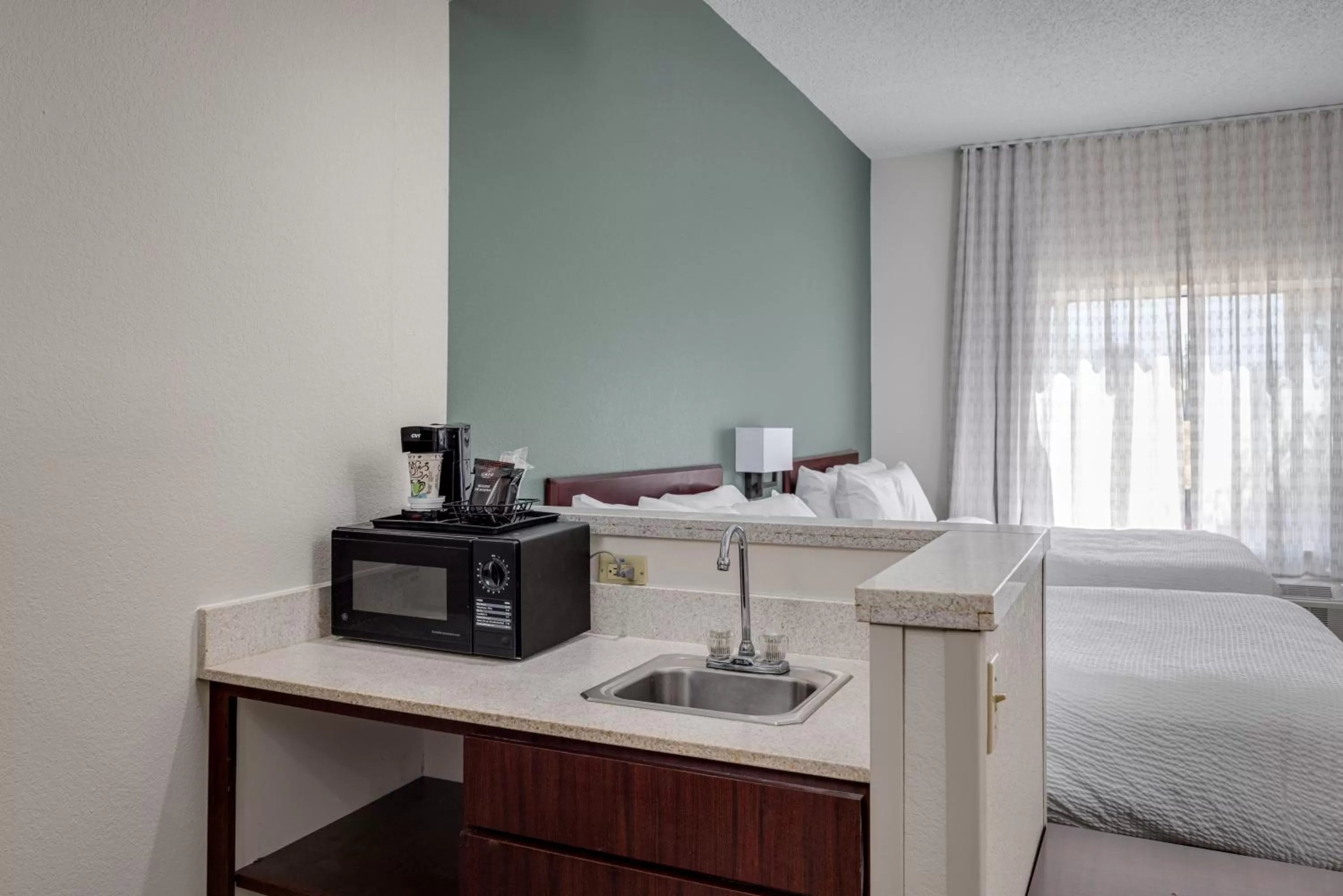 Kitchen or kitchenette, Bed in MySuites Lawton