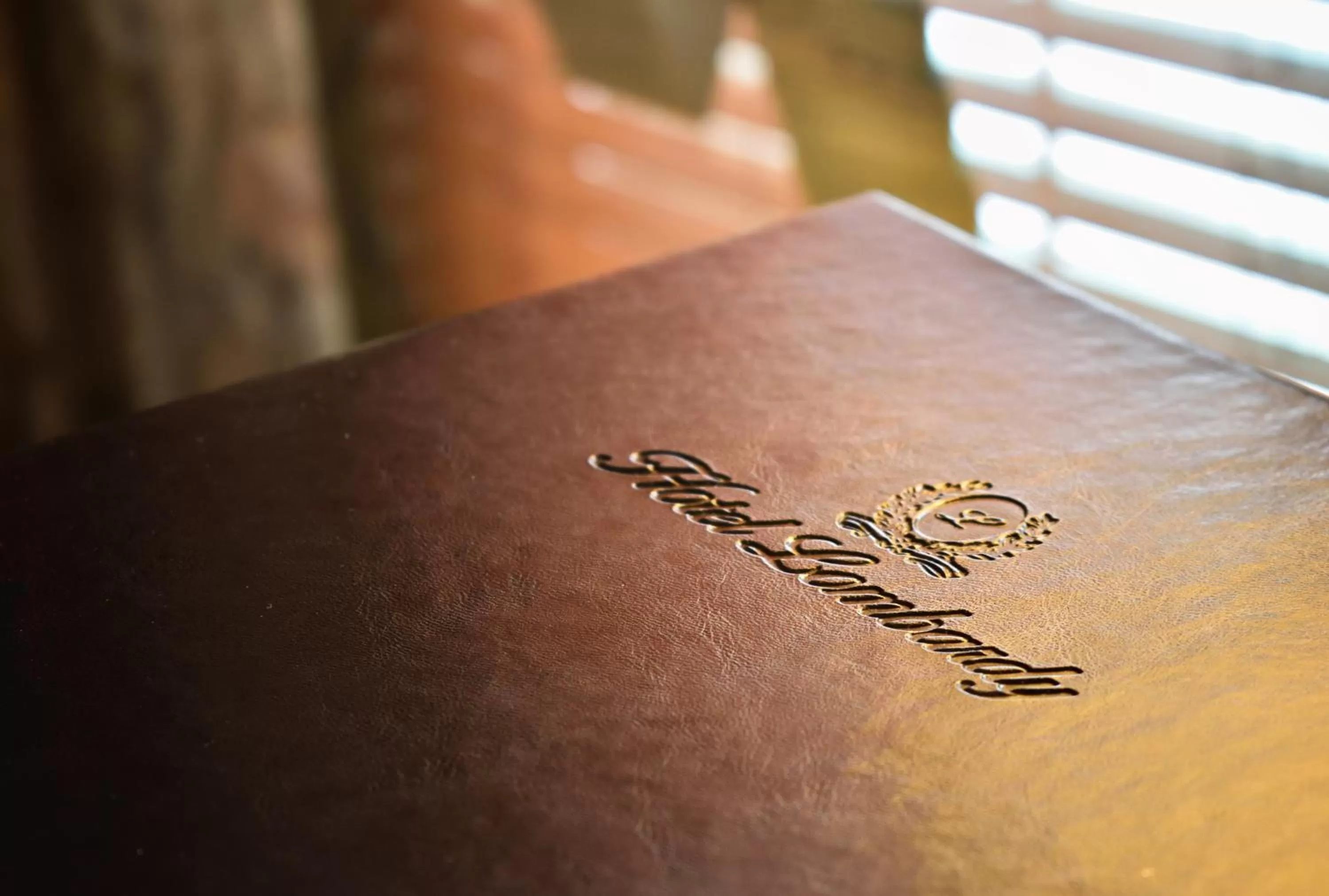 Property logo or sign in Hotel Lombardy