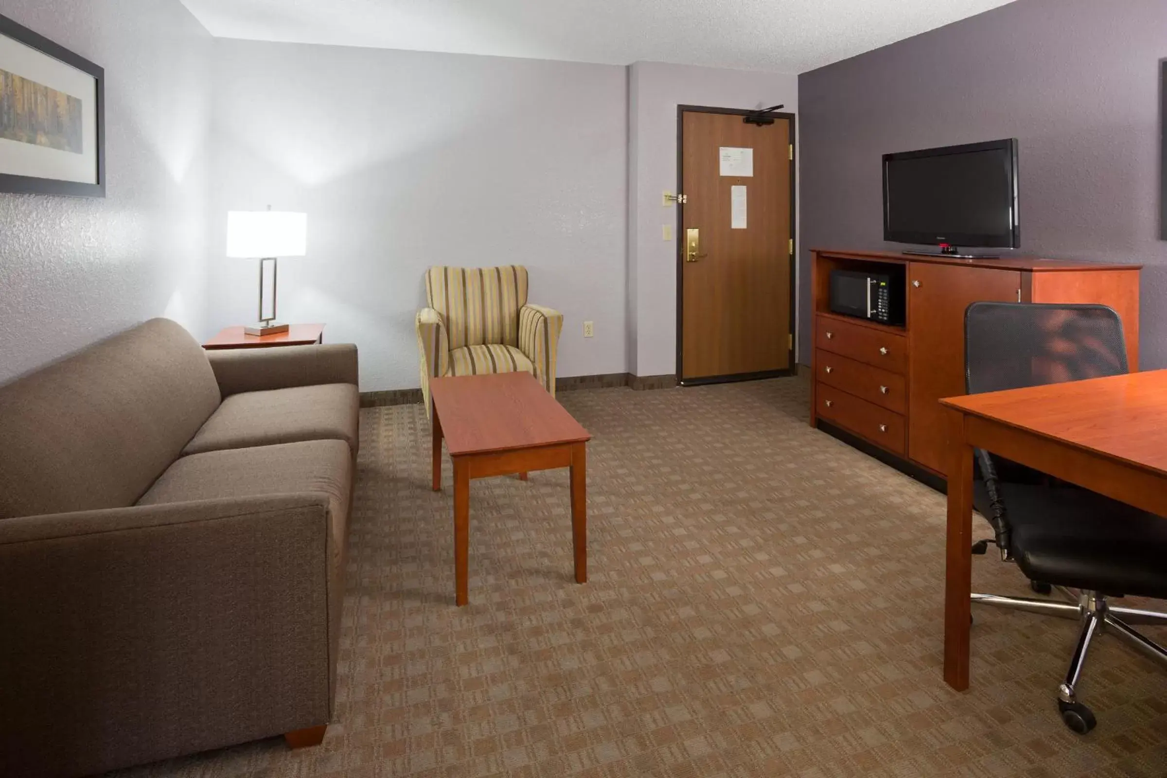 Living room, Seating Area in AmericInn by Wyndham Ankeny/Des Moines