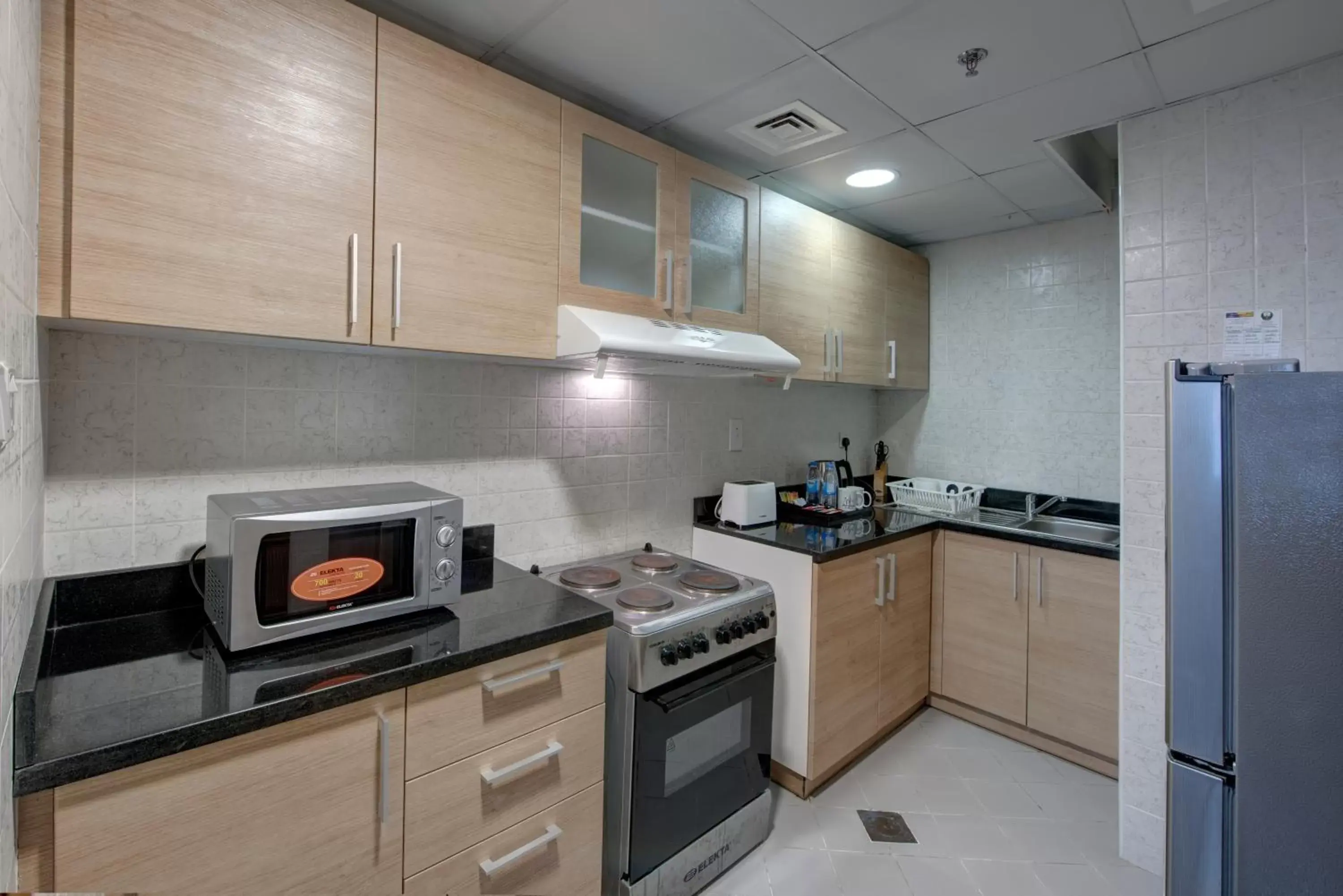 Kitchen or kitchenette, Kitchen/Kitchenette in City Stay Beach Hotel Apartments - Marjan Island