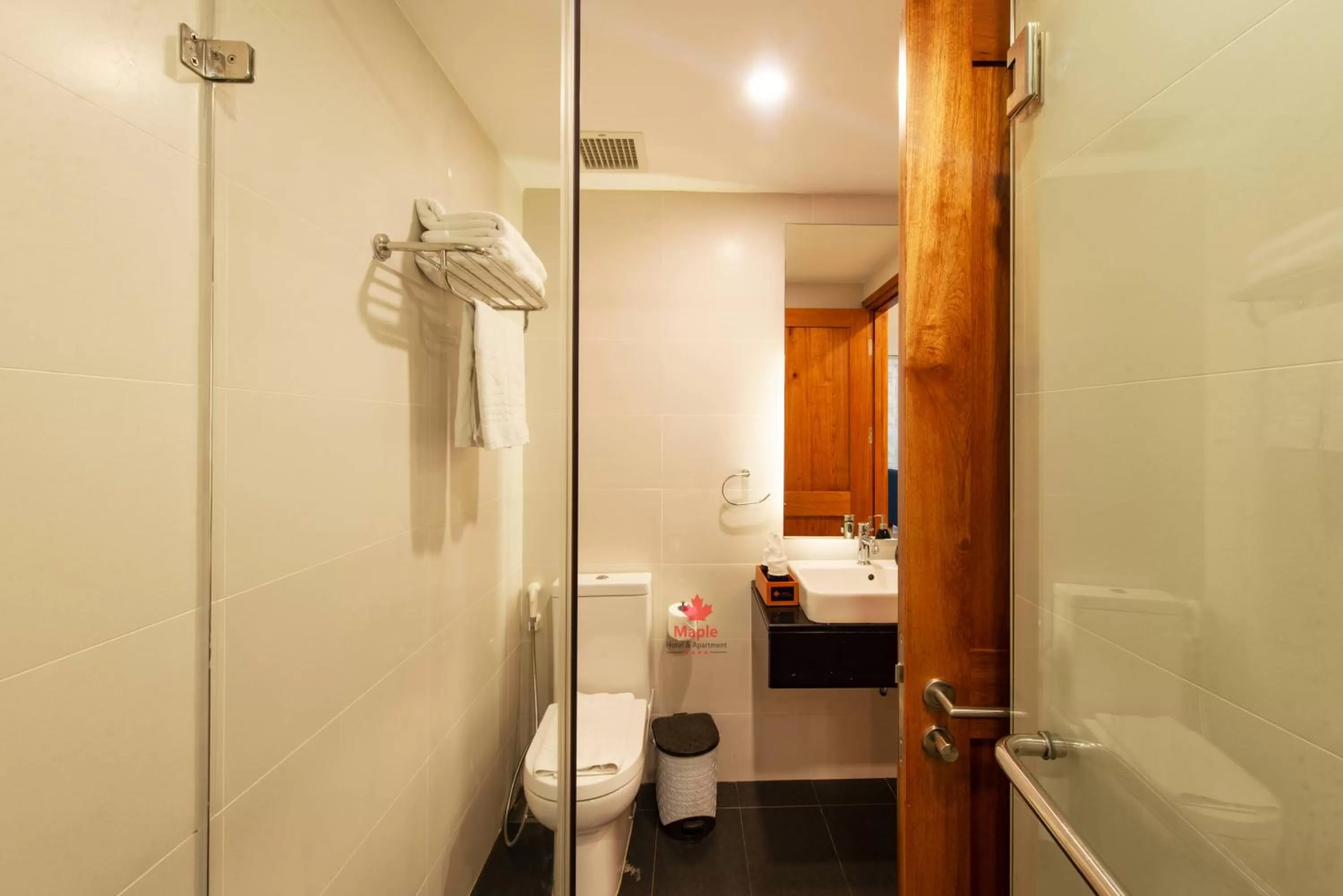 Toilet in Maple Hotel & Apartment