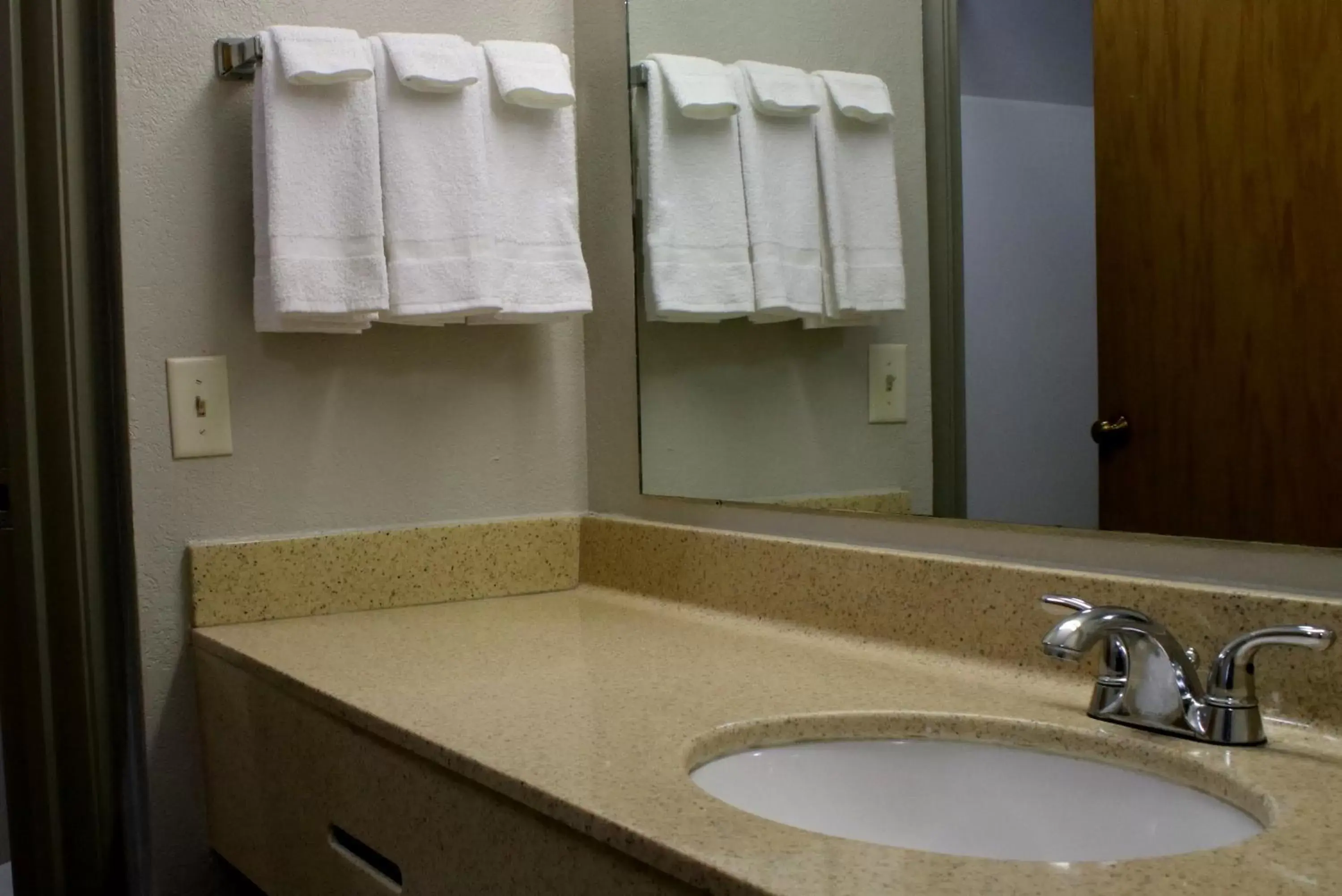 Bathroom in Days Inn & Suites by Wyndham Bloomington/Normal IL