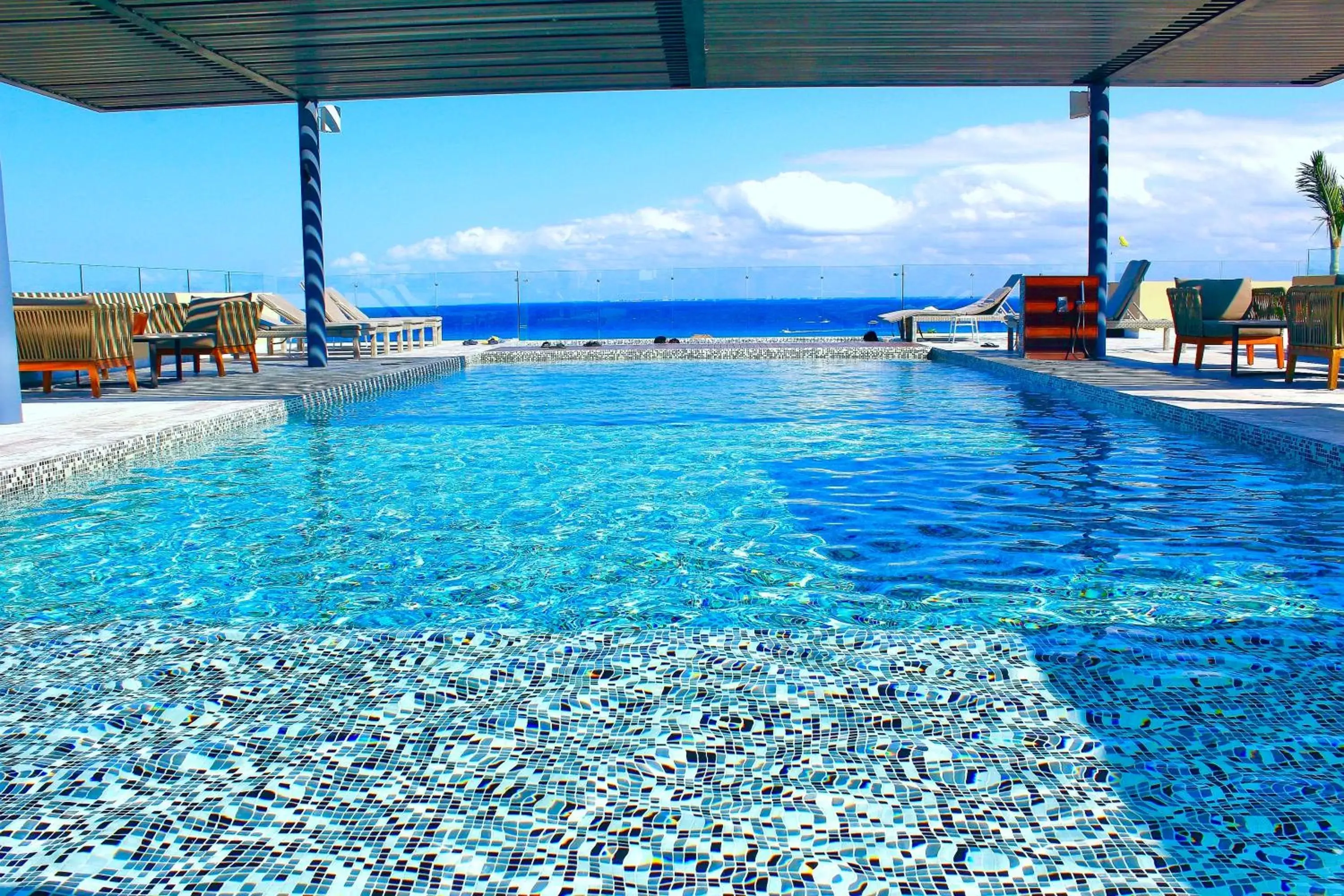 Seating area, Swimming Pool in Singular Joy Vacation Rentals