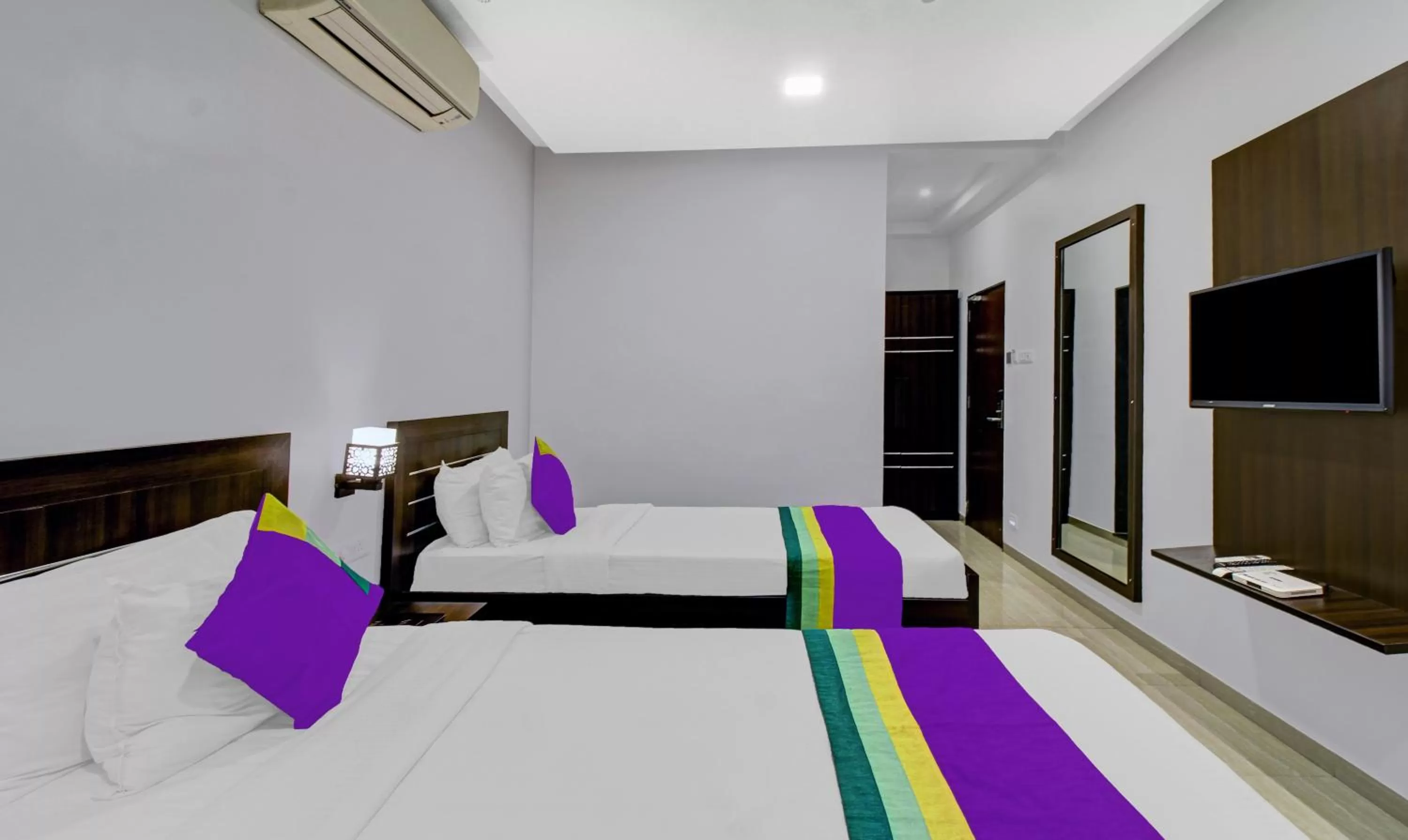 Bedroom, Bed in Treebo Premium Brijinn