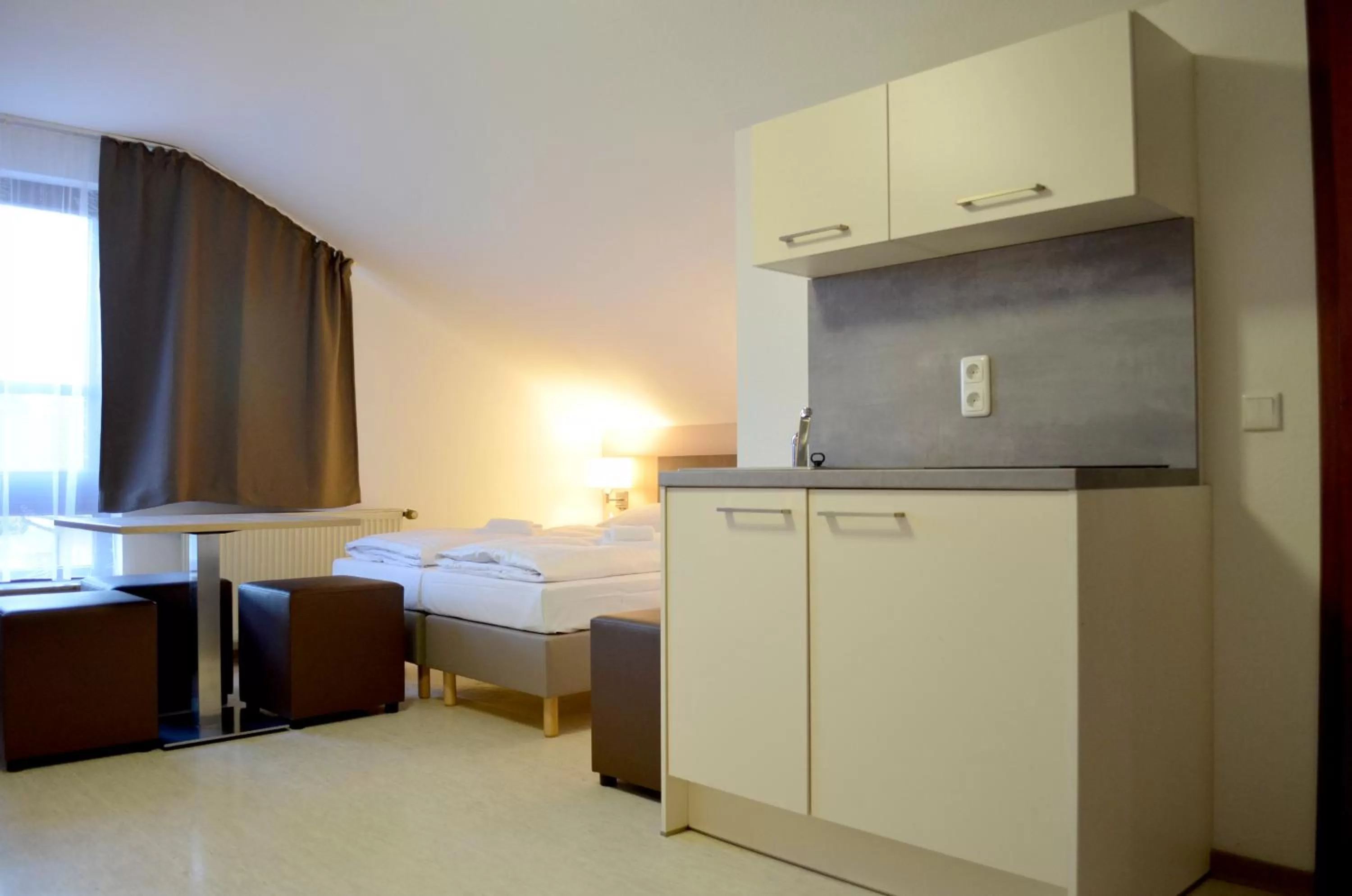 Kitchen or kitchenette, Bed in Hana Aparthotel