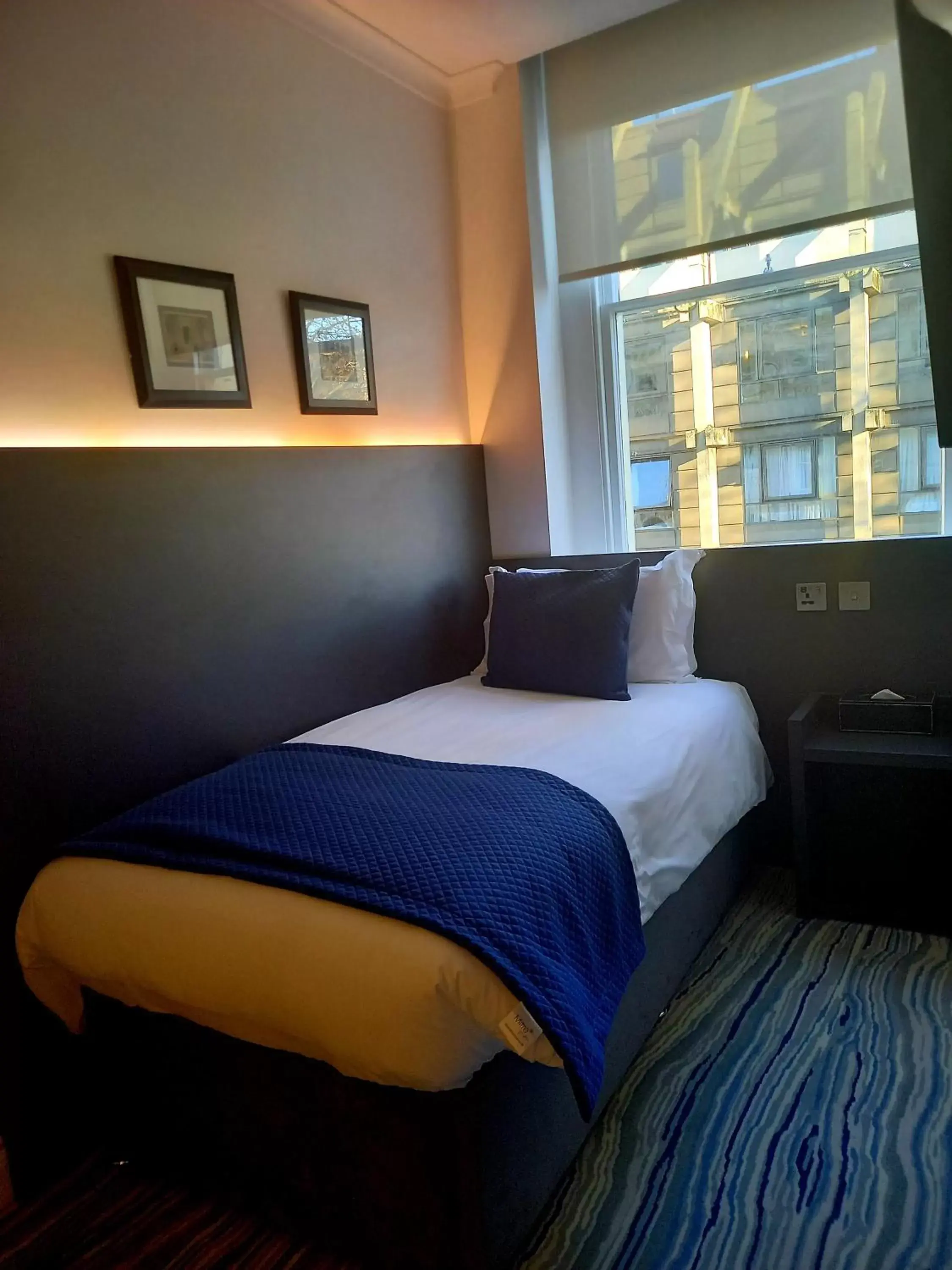 Bed in Commodore Hotel