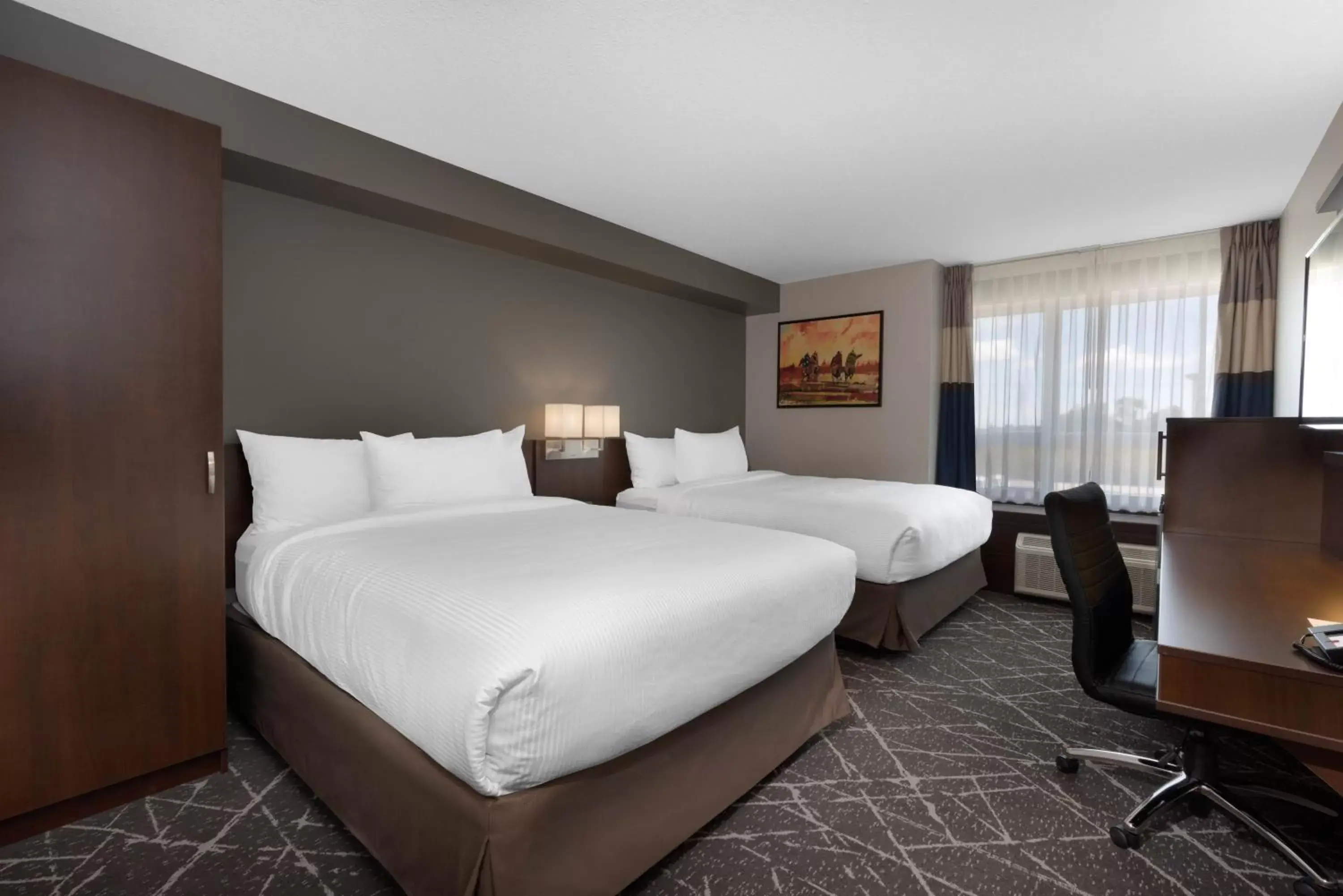 Bed in Microtel Inn & Suites by Wyndham Portage La Prairie