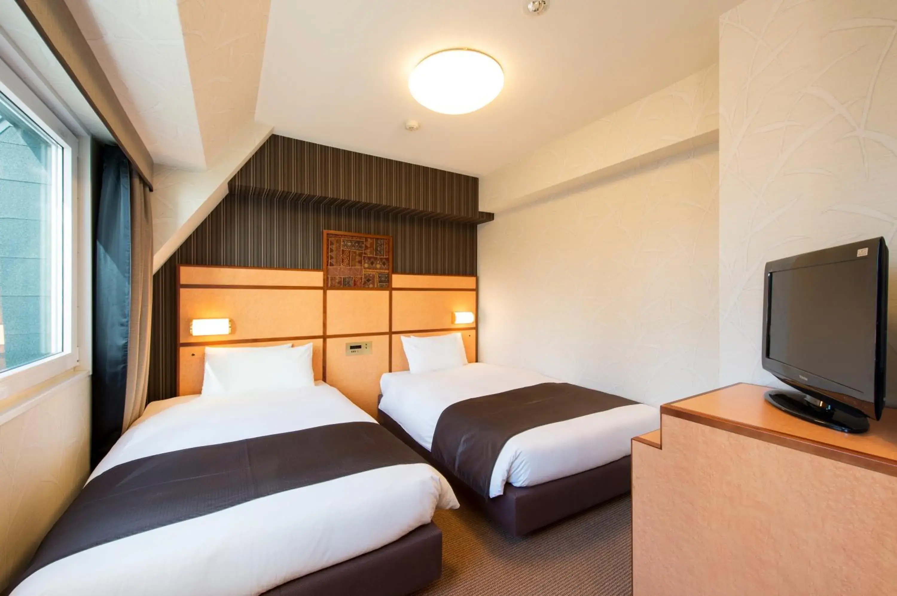 Bed in Hotel Villa Fontaine Tokyo-Hamamatsucho