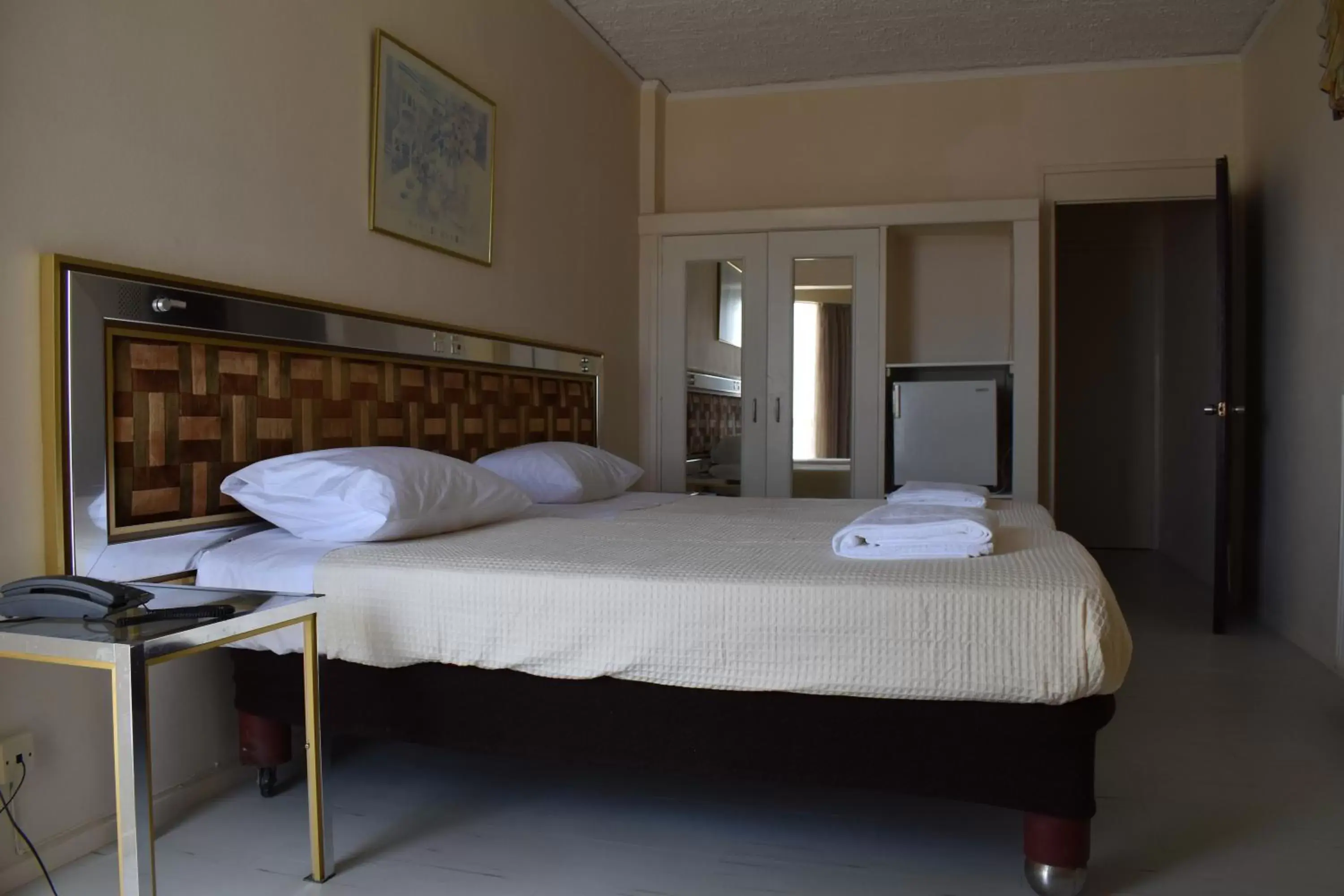 Bed in Hotel Theoxenia