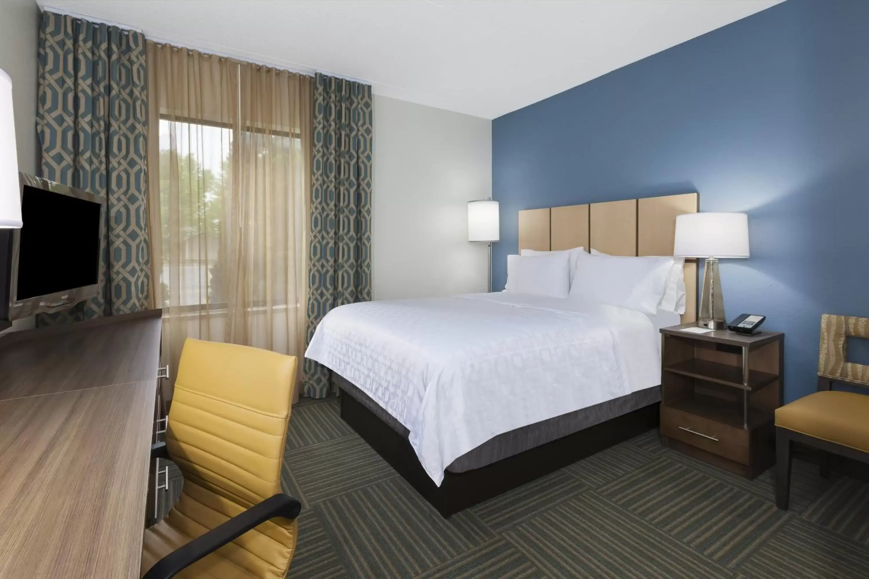 Photo of the whole room, Bed in Candlewood Suites Grand Rapids Airport, an IHG Hotel
