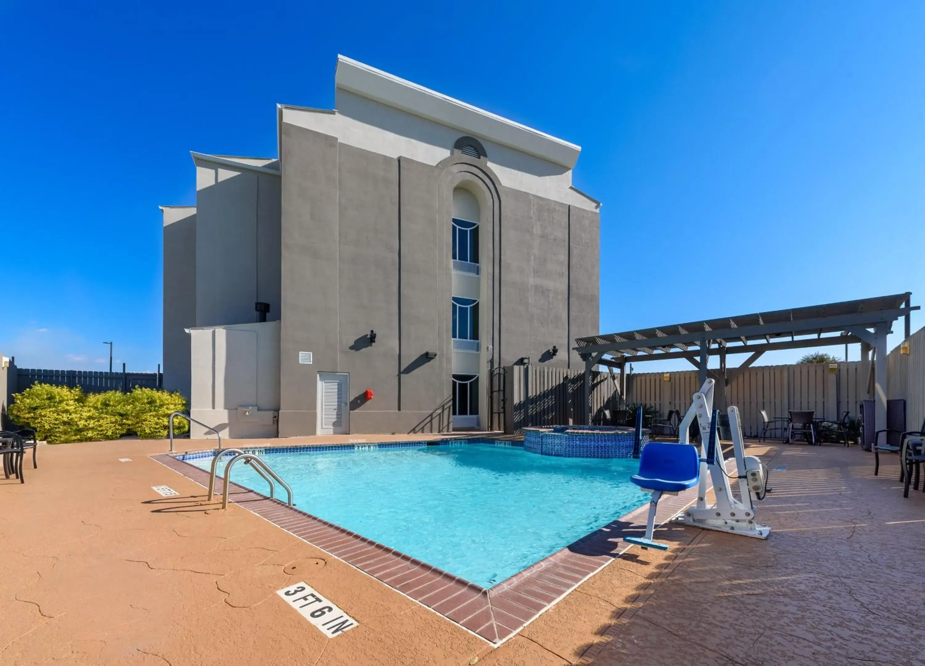 Swimming pool, Property Building in Holiday Inn Express Hotel and Suites Bastrop, an IHG Hotel