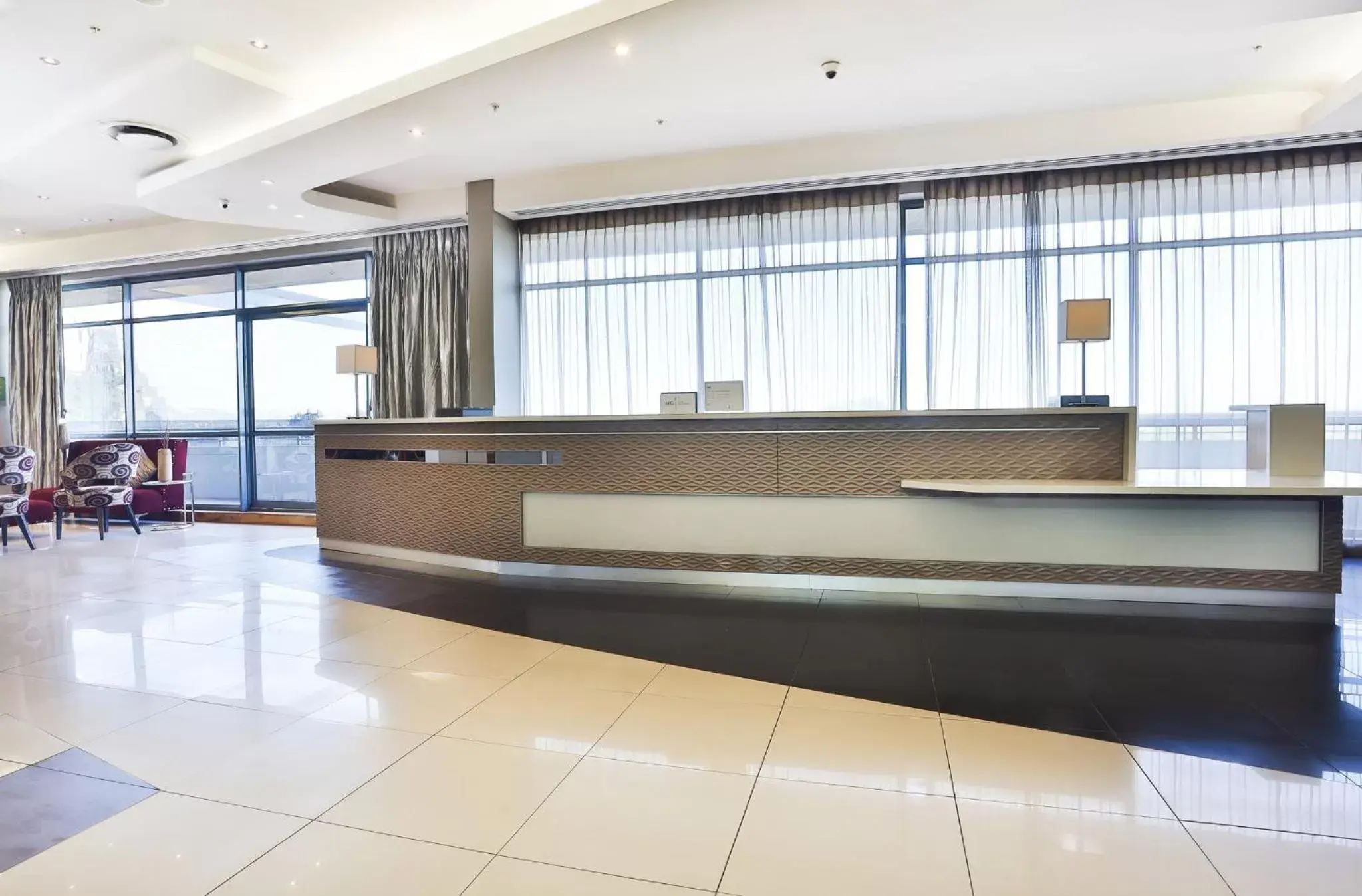 Property building, Lobby/Reception in Holiday Inn Johannesburg-Rosebank, an IHG Hotel