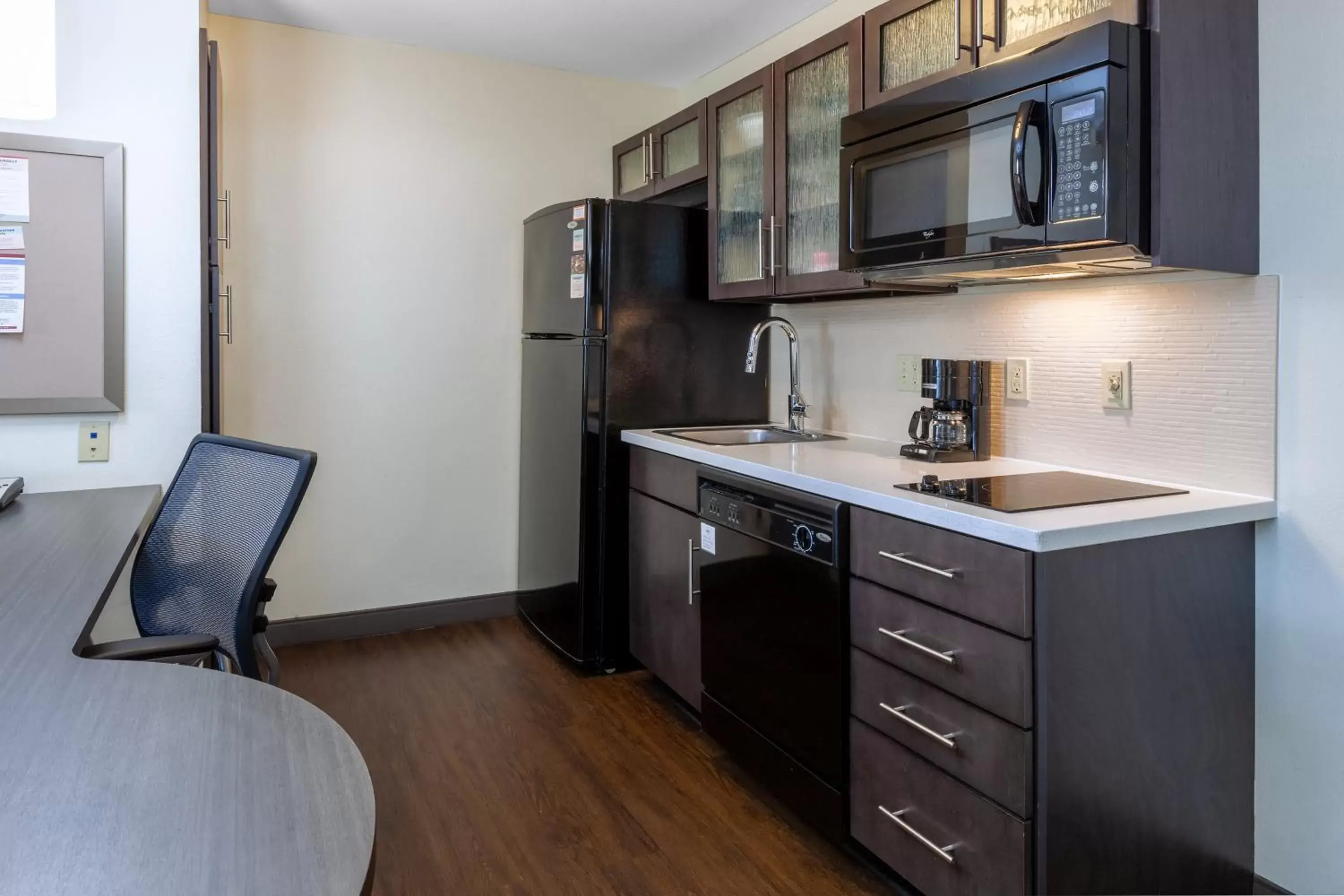 Photo of the whole room, Kitchen/Kitchenette in Candlewood Suites Kalamazoo, an IHG Hotel