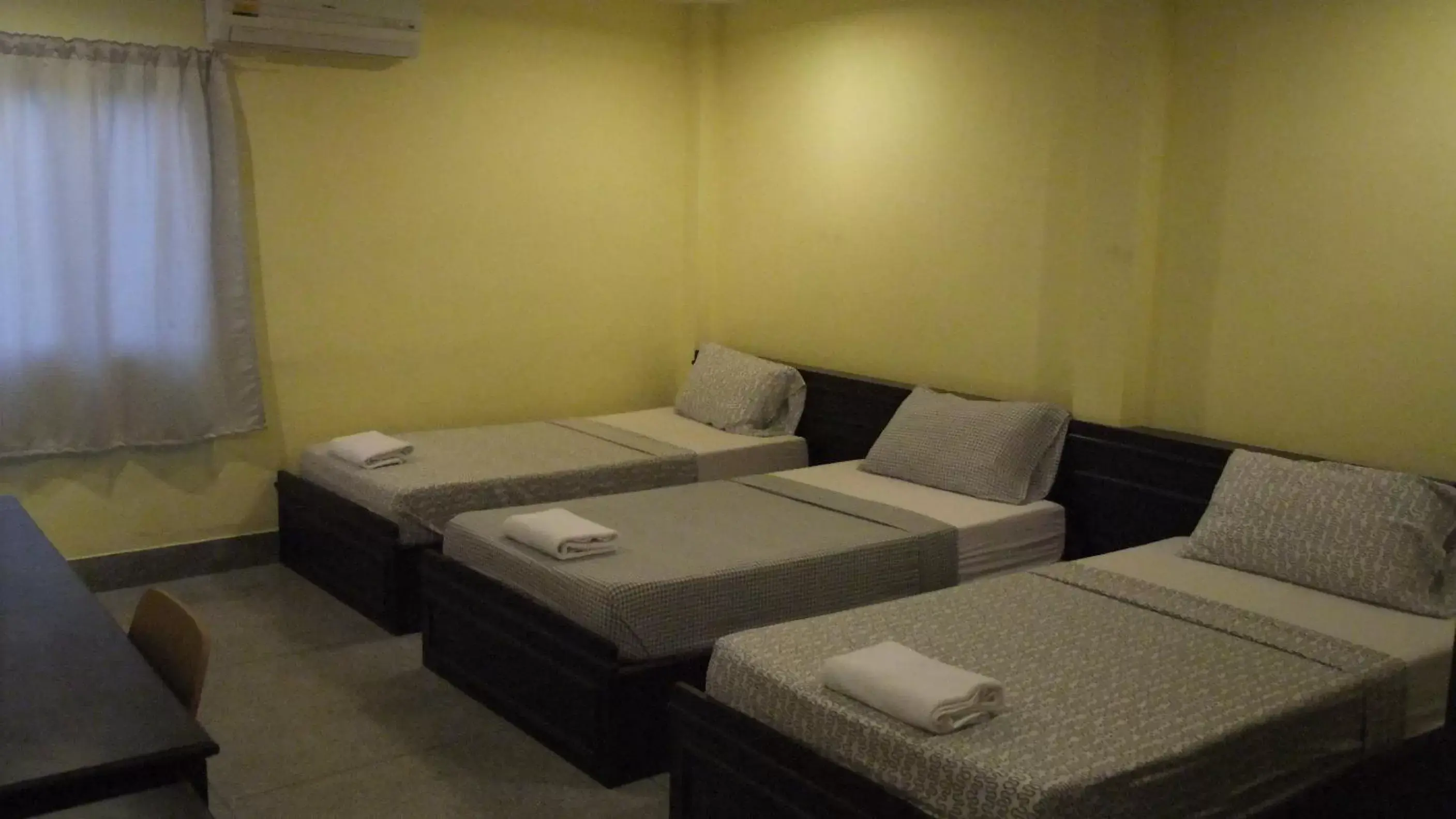Bed in Sri Krungthep Hotel