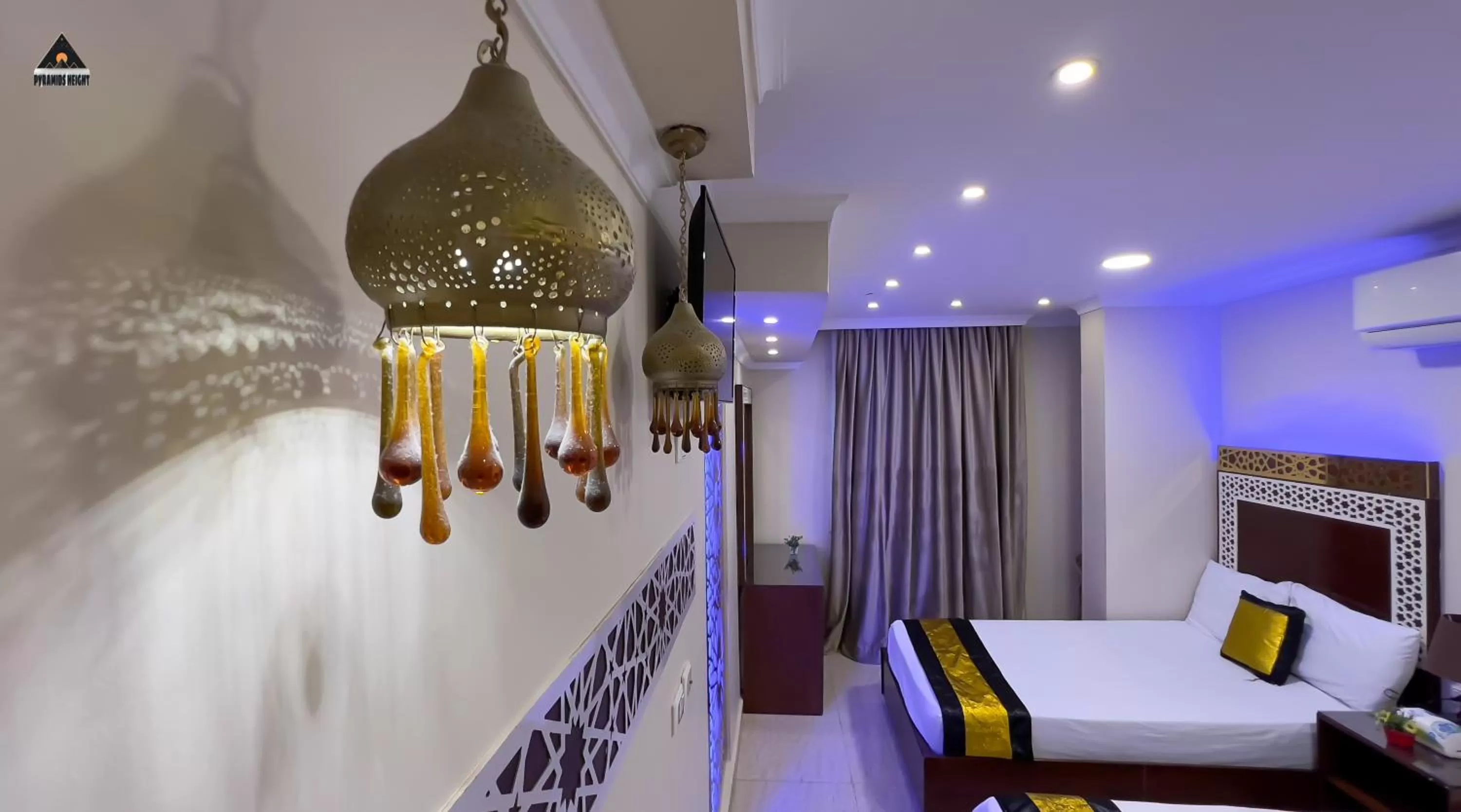 Bed in Pyramids Height Hotel & Pyramids Master Scene Rooftop