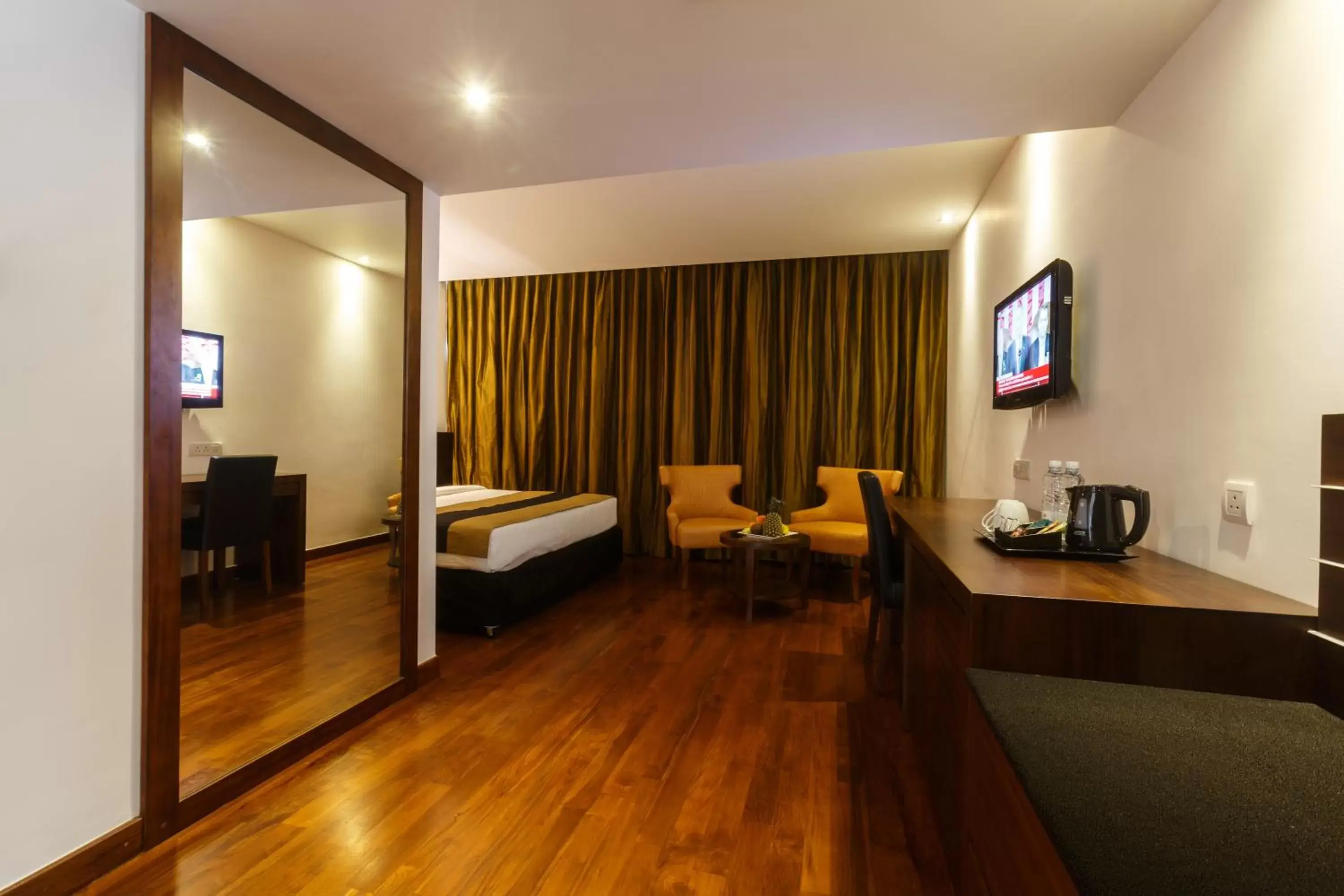 Photo of the whole room, TV/Entertainment Center in Renuka City Hotel