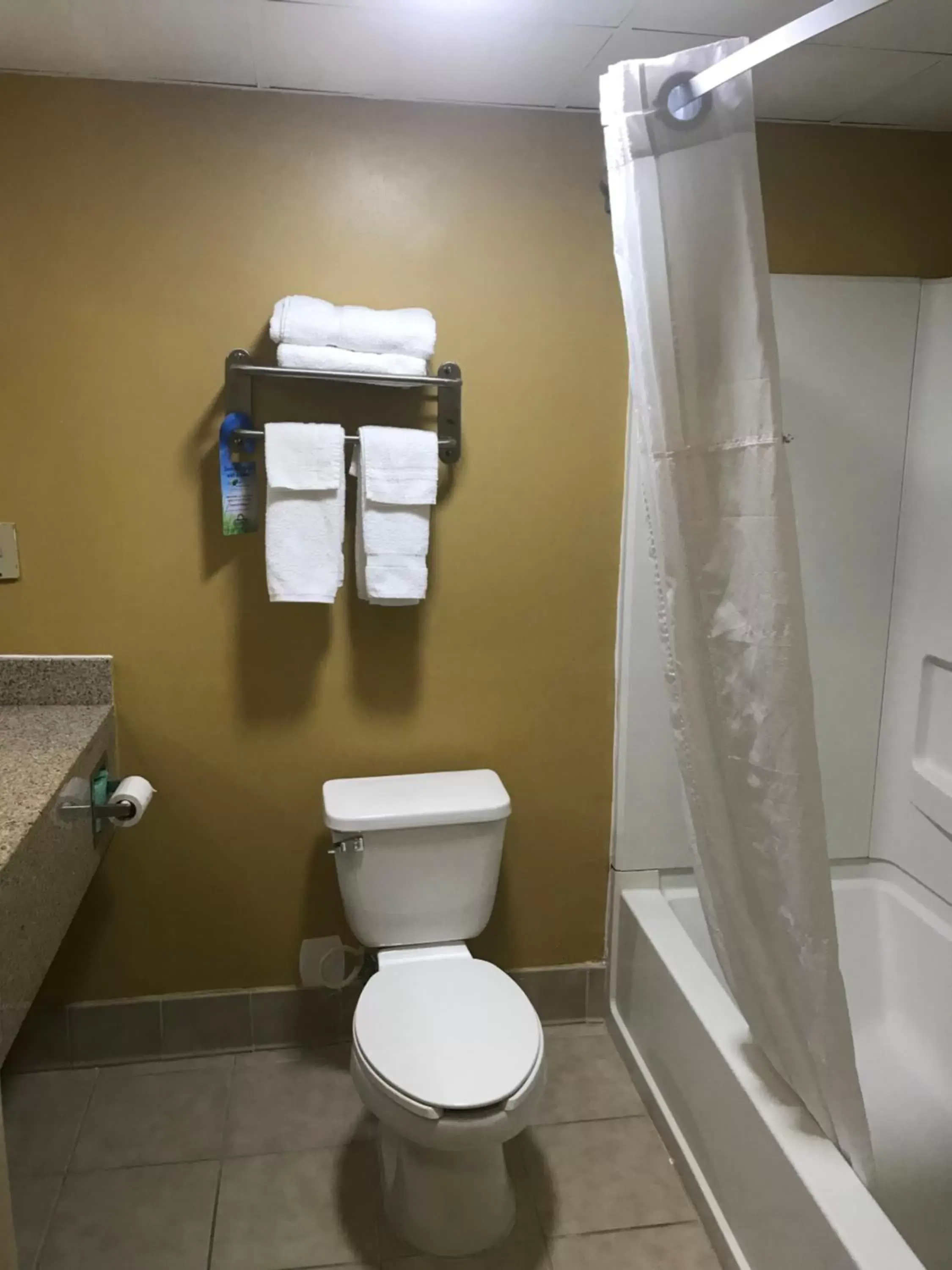 Bathroom in Days Inn & Suites by Wyndham Tucker/Northlake