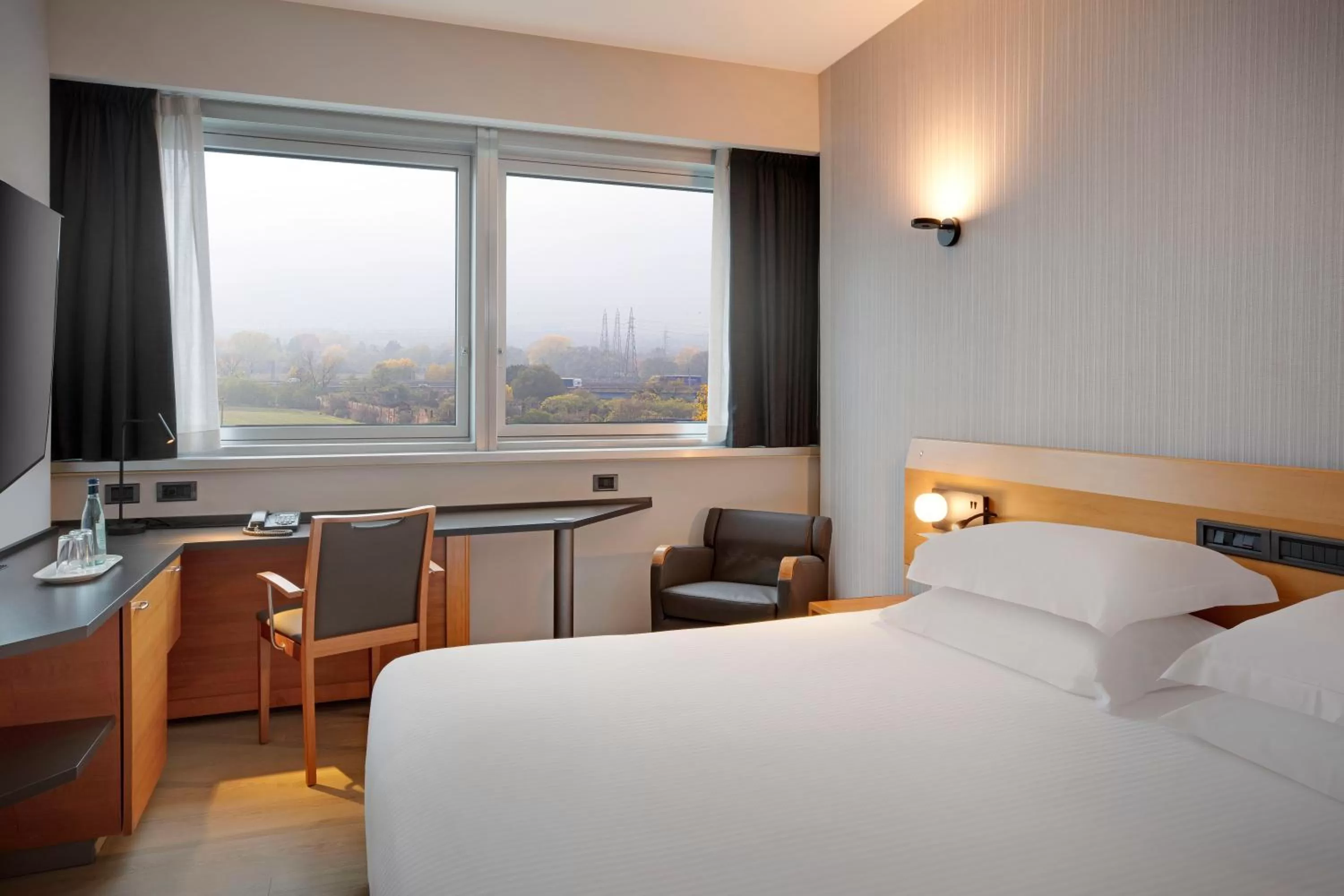 Photo of the whole room, Bed in Crowne Plaza Milan Linate by IHG
