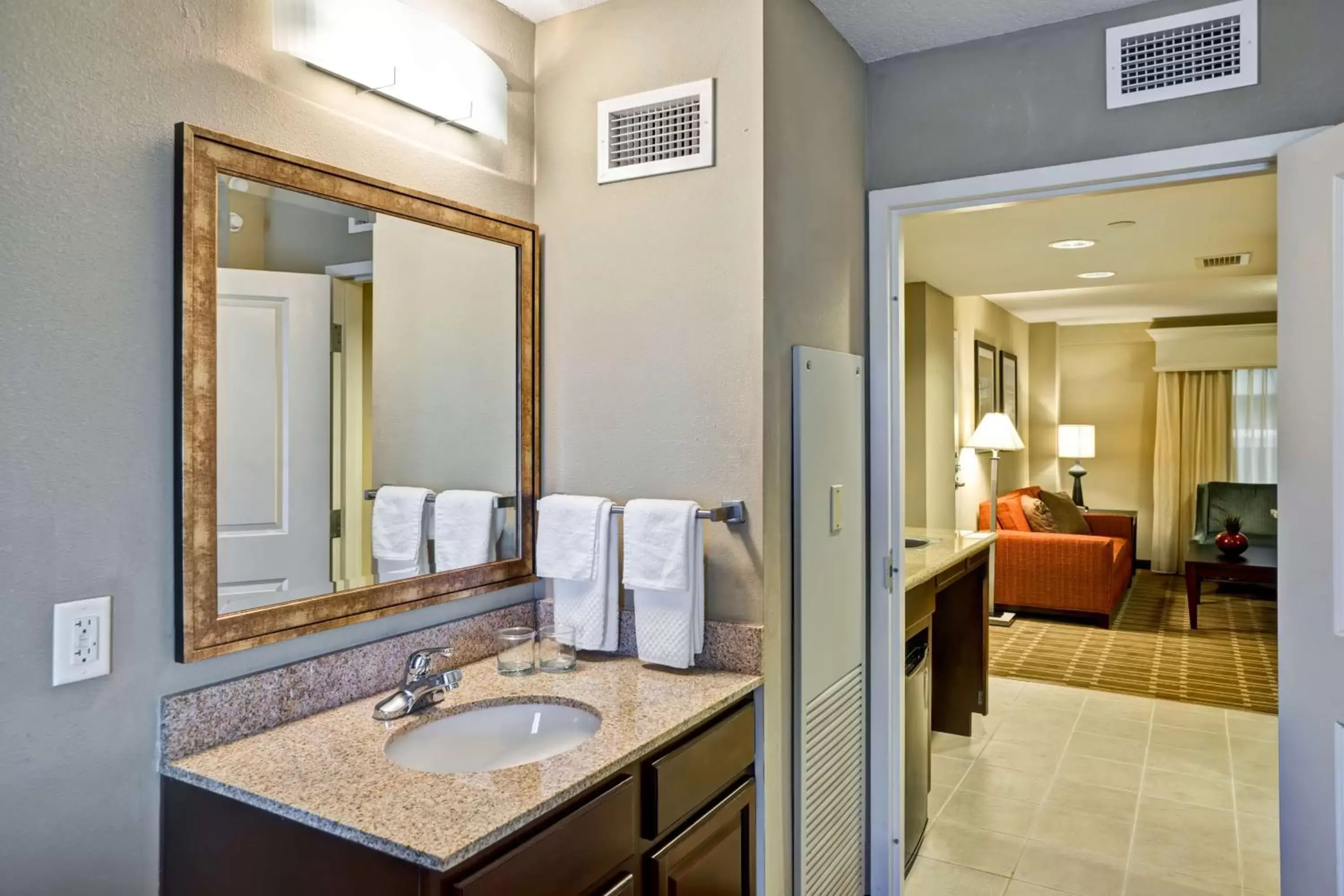 Living room, Bathroom in Embassy Suites Fort Myers - Estero