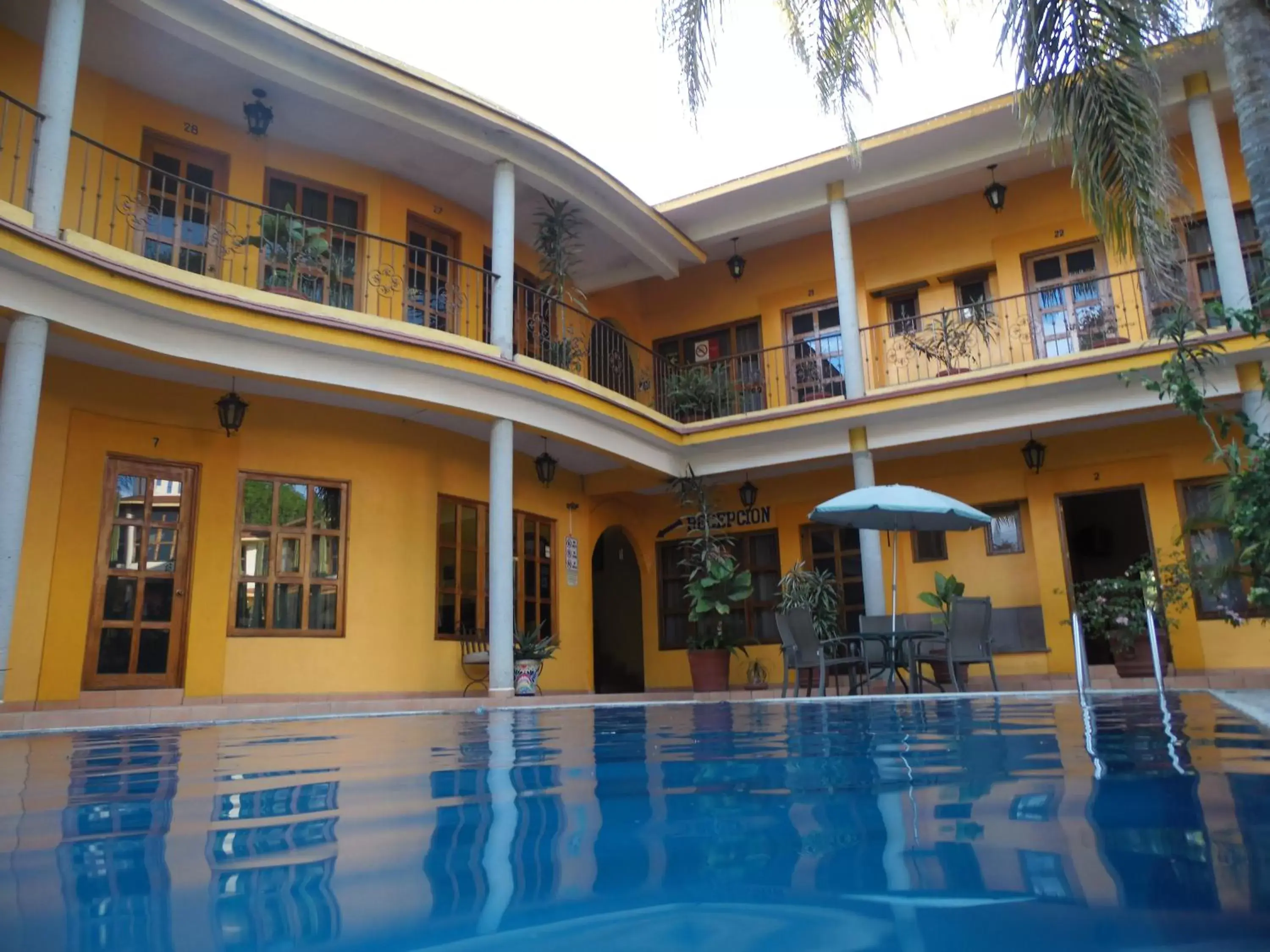 Swimming pool, Property Building in Hotel Plaza del Sol