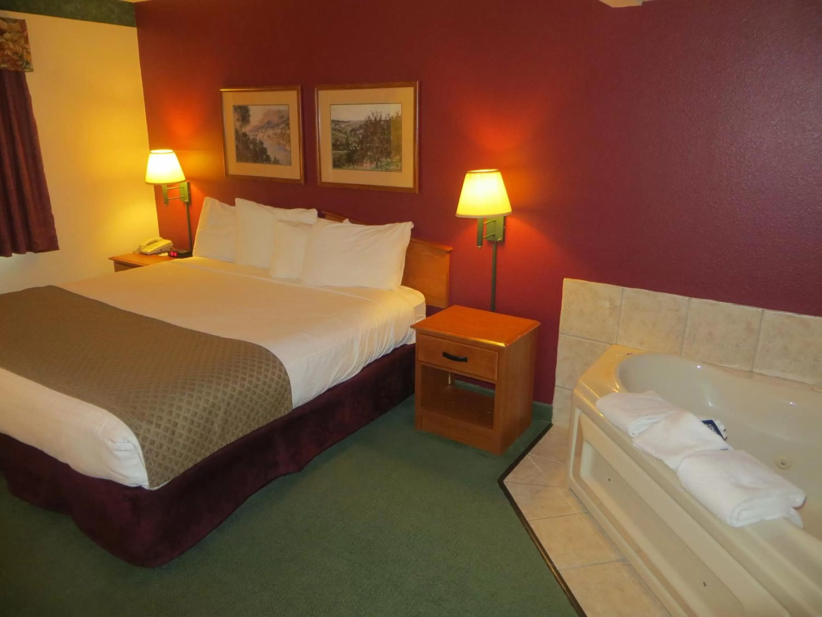 Bed in AmericInn by Wyndham Manitowoc