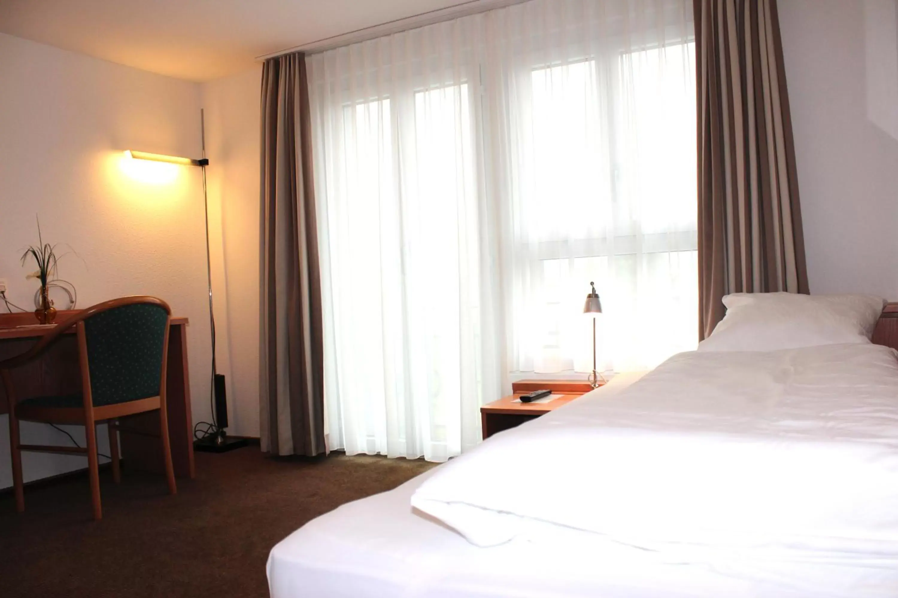Bed in Hotel Freihof Swiss Lodge