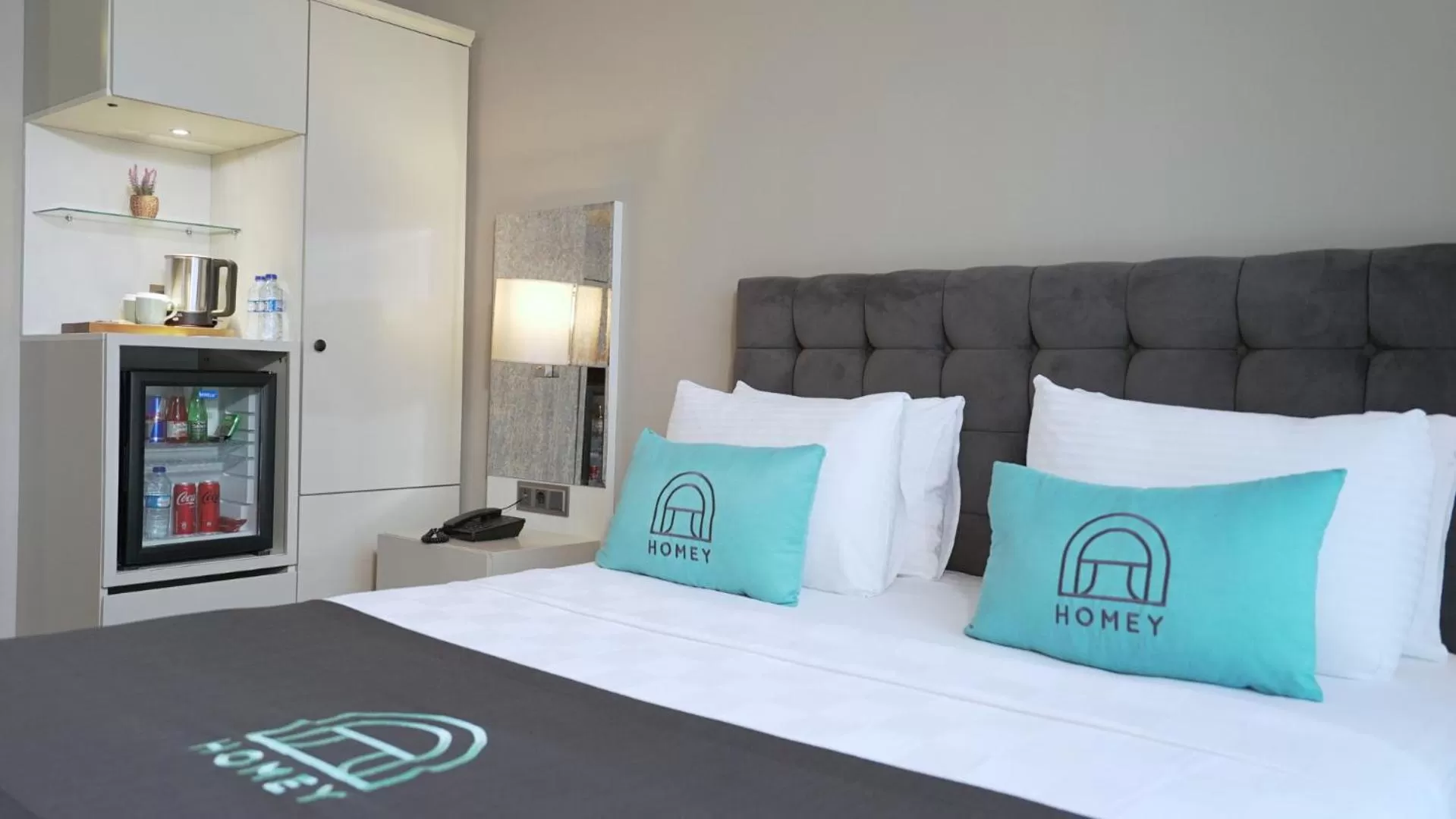 Bed in Homey AirPort Hotel