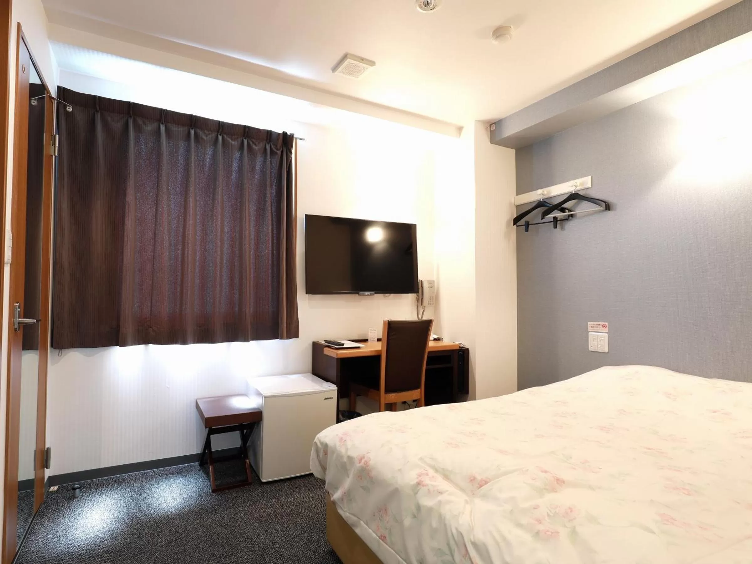 Bed in Toyama Town Hotel