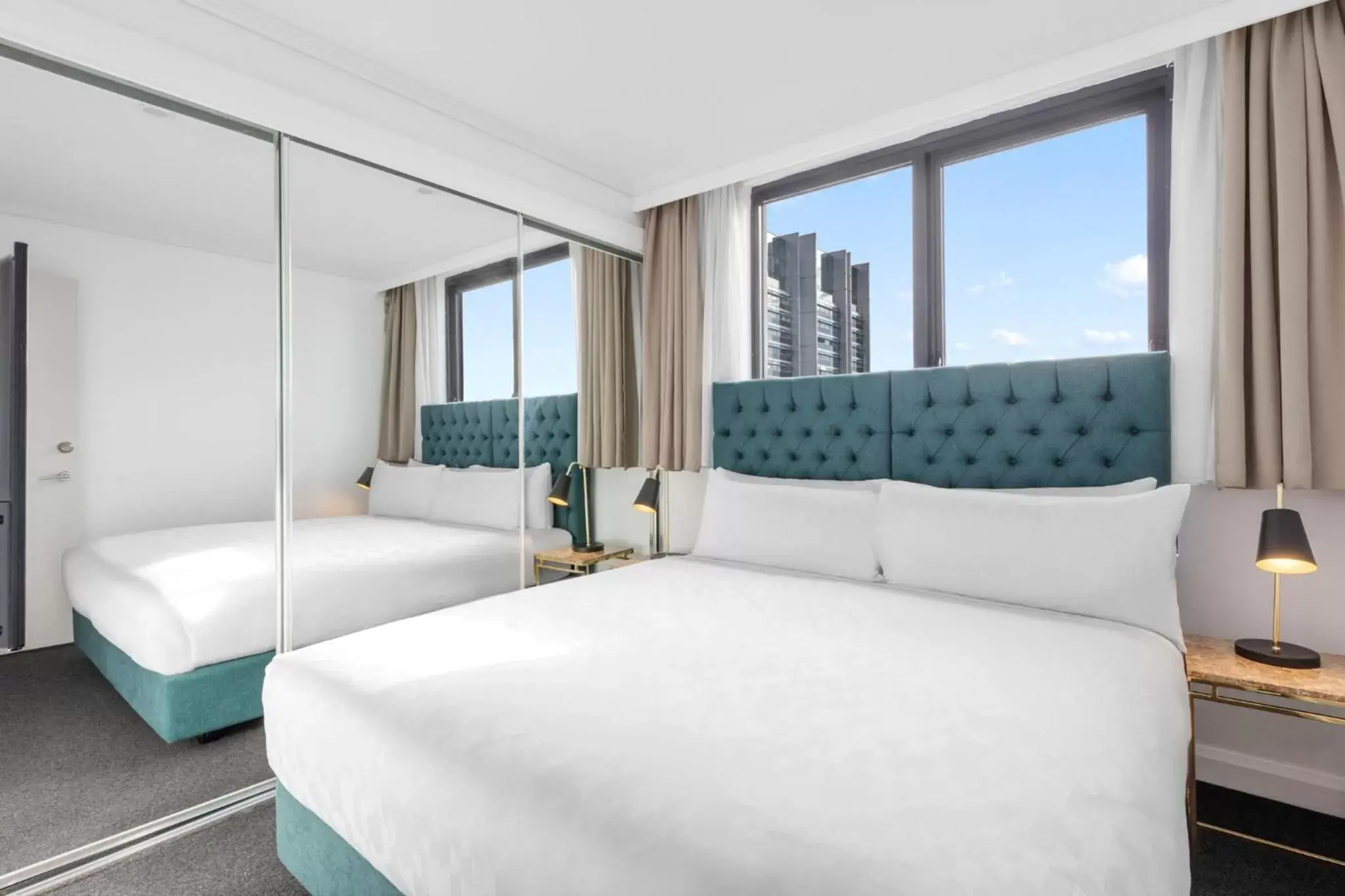 Bed in Meriton Suites Pitt Street, Sydney