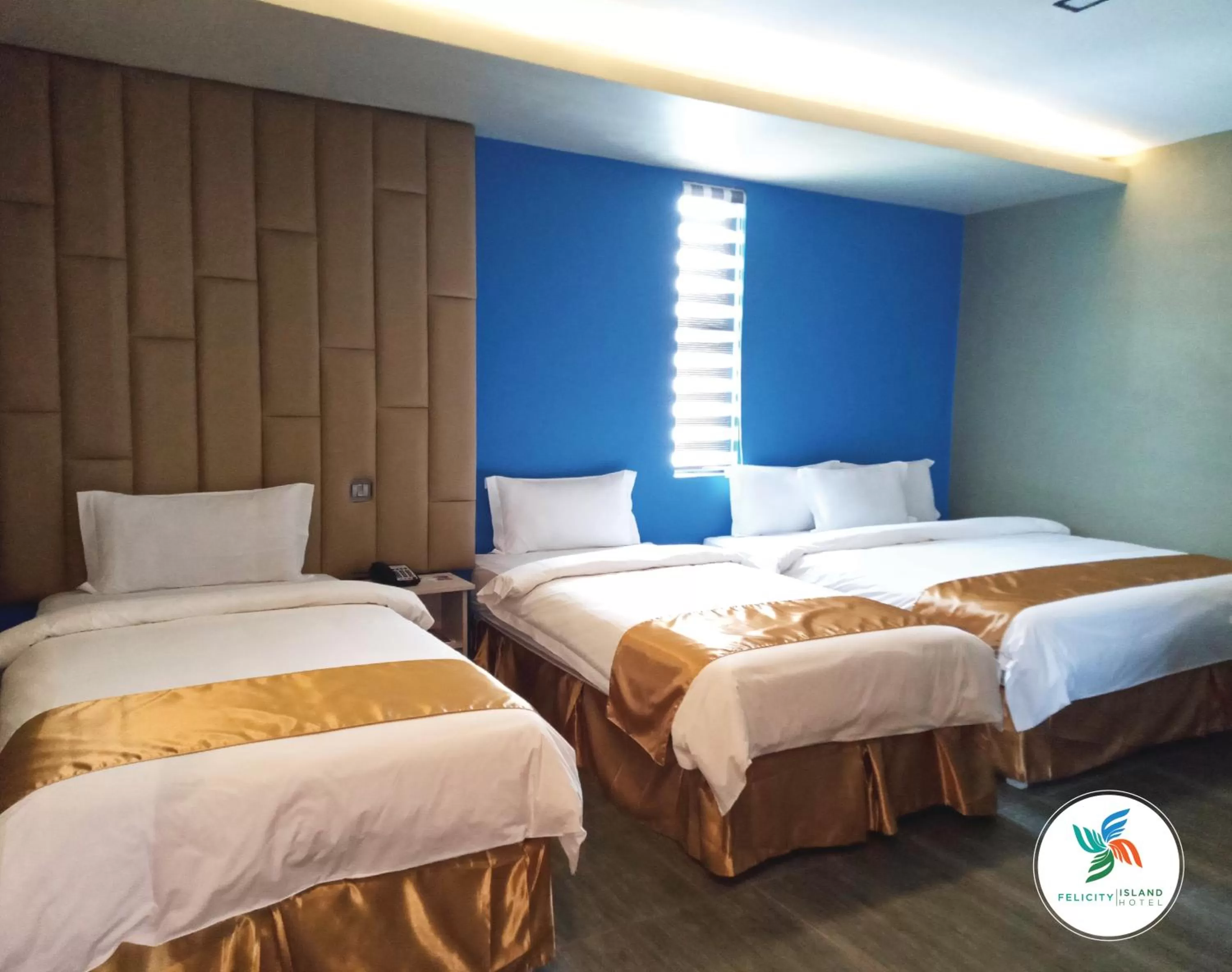 Bed in Felicity Island Hotel