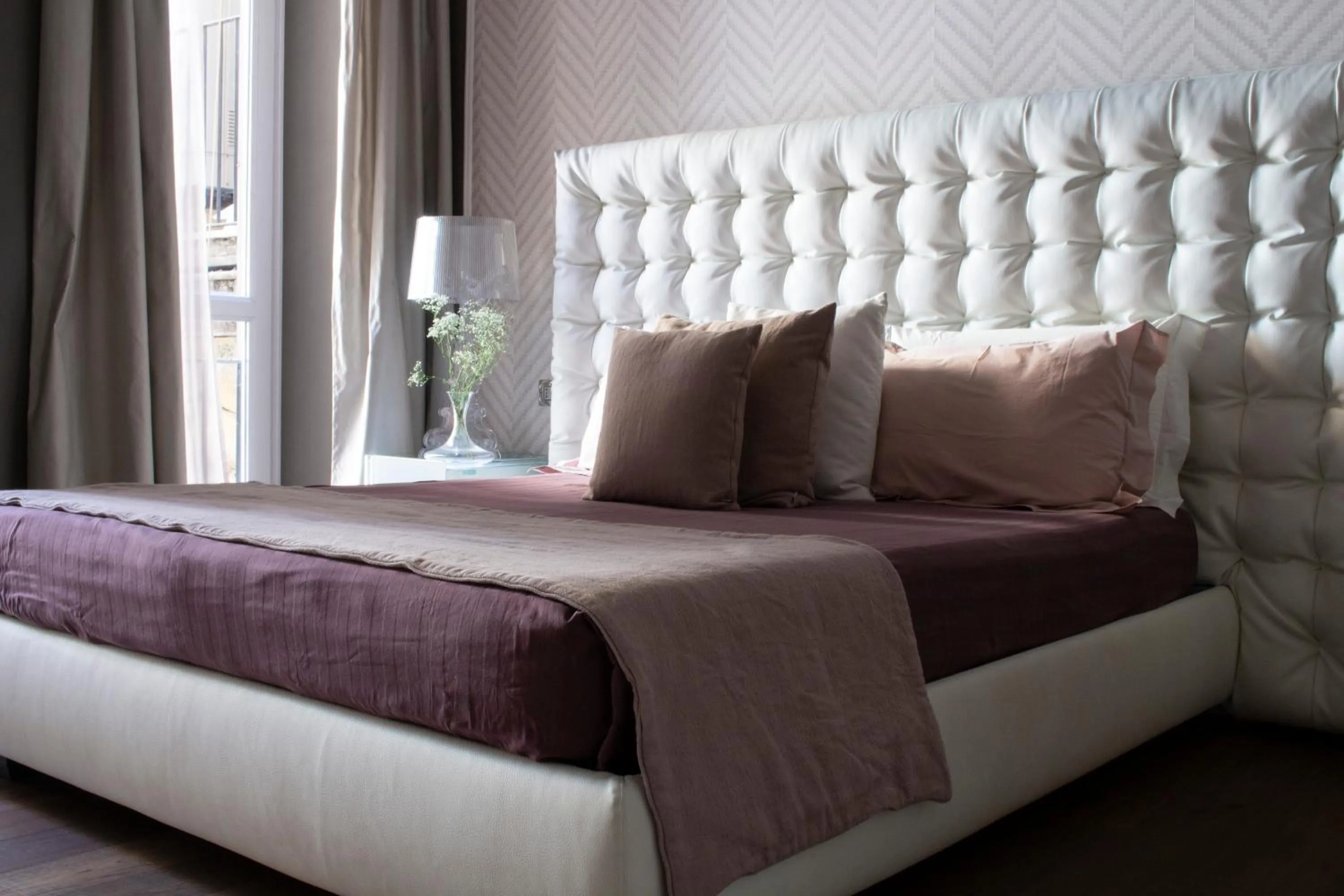 Bed in Le Quattro Dame Luxury Suites