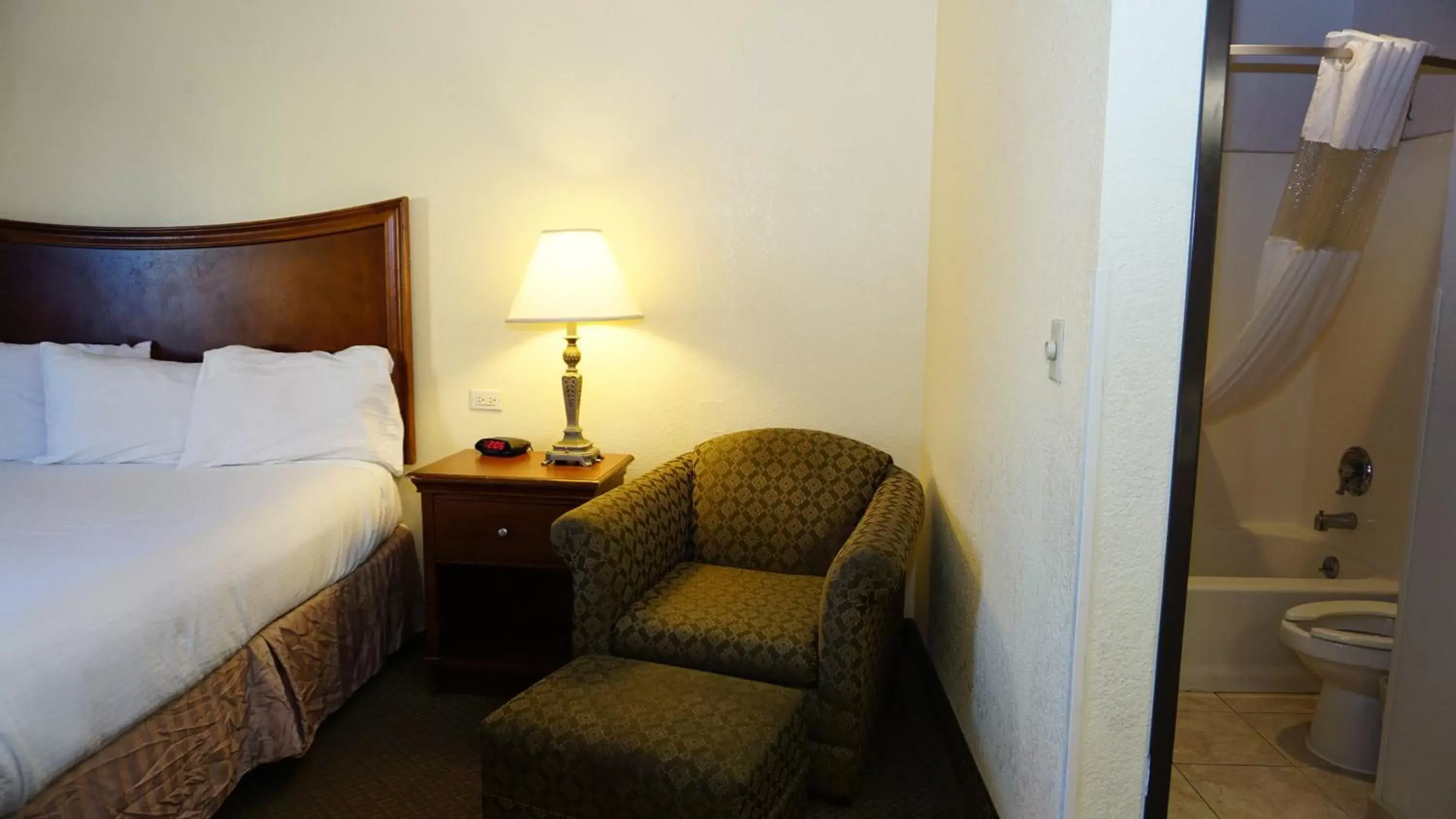 Seating area, Bed in Baymont by Wyndham Arlington At Six Flags Dr