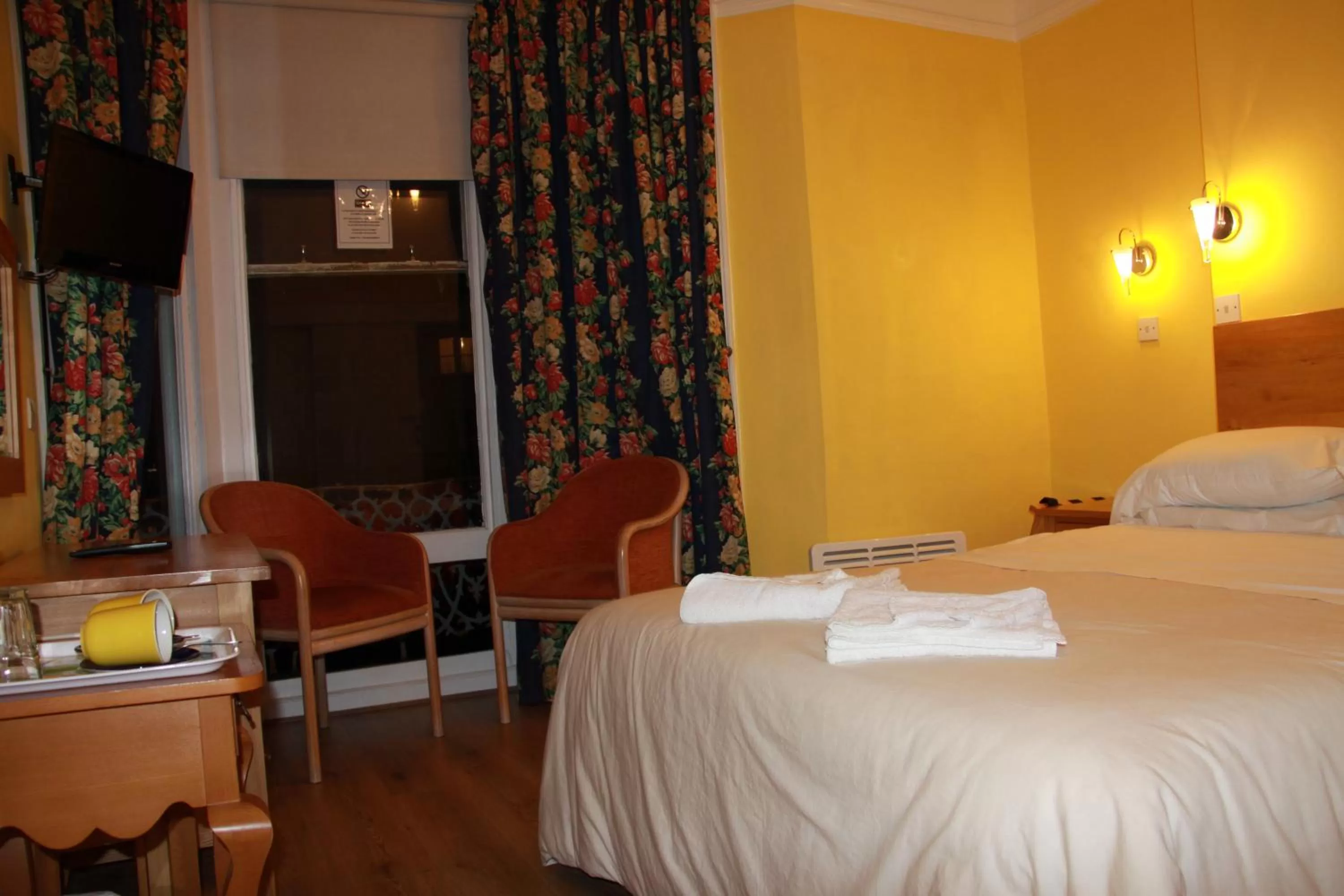 Bed in Ambassador Hotel