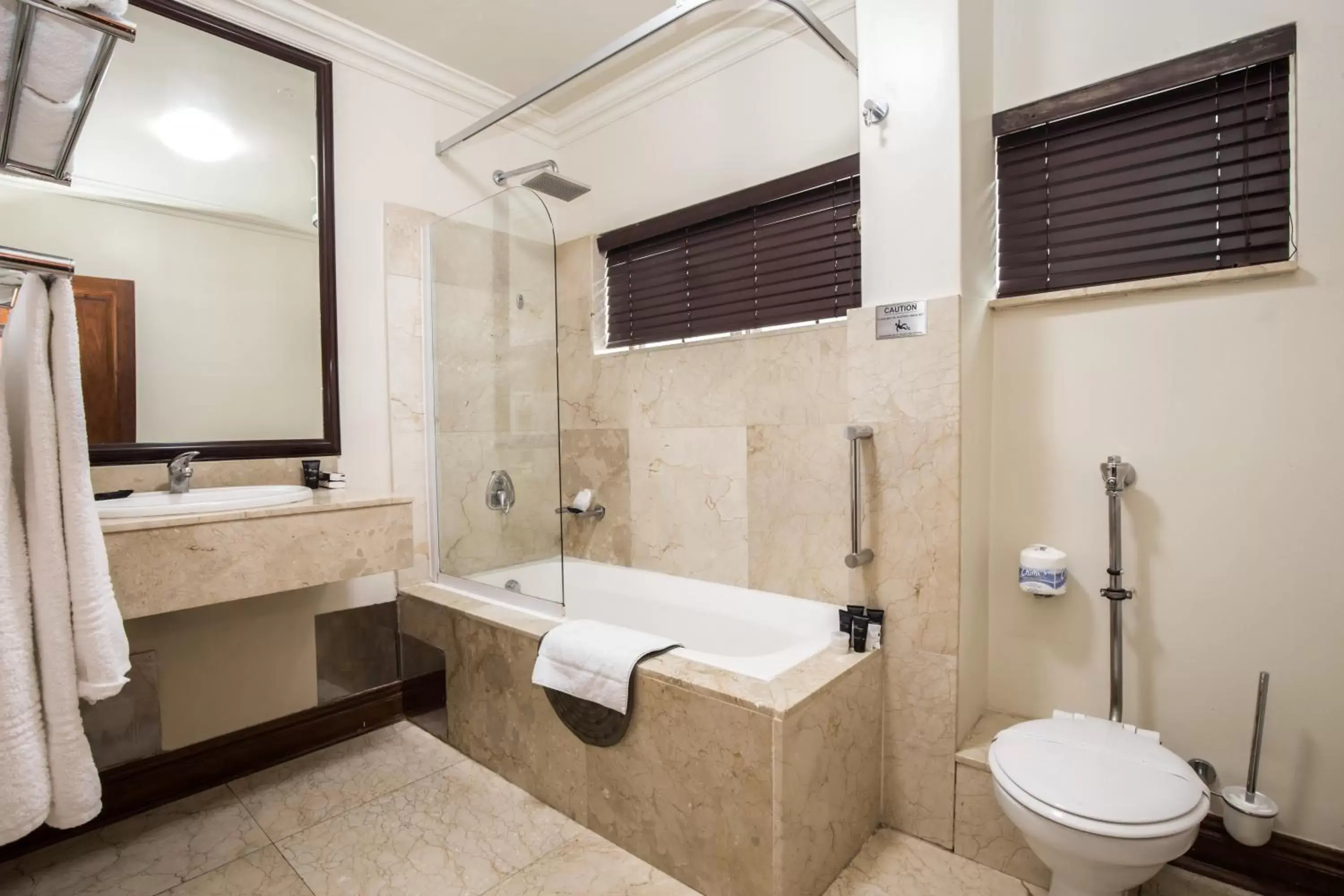 Bathroom in Belaire Suites Hotel