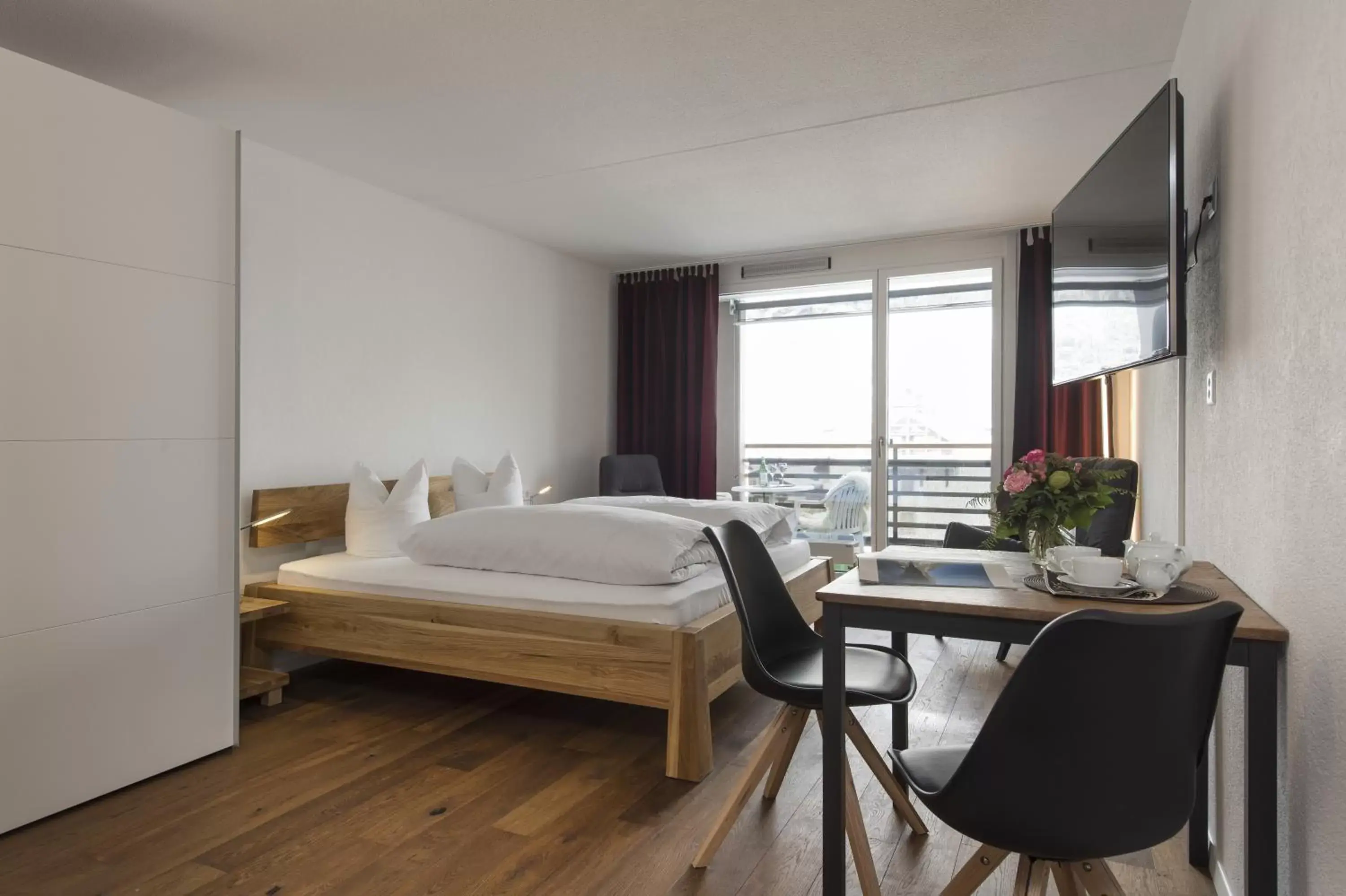 Bedroom in Hotel des Alpes