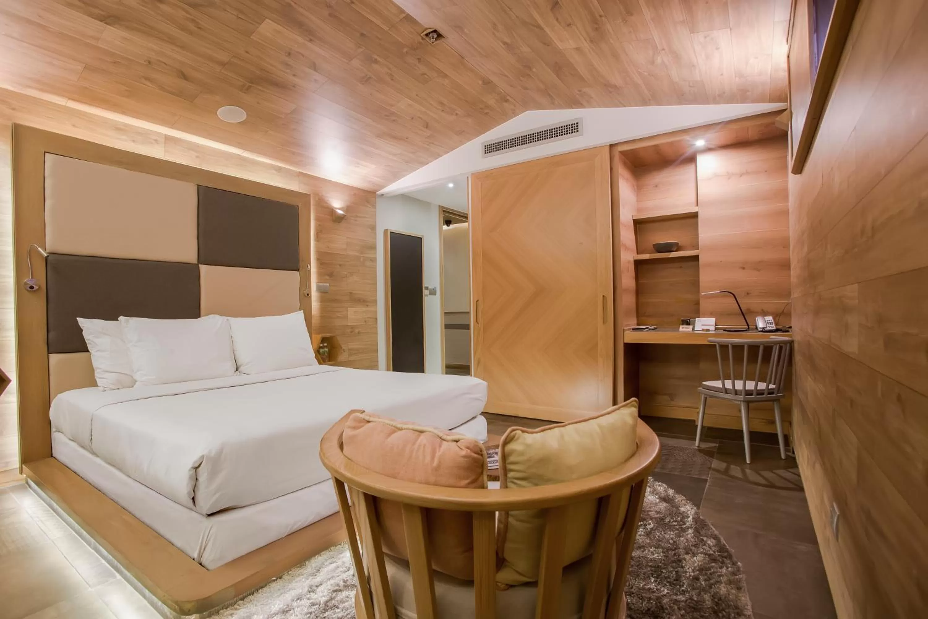 Photo of the whole room, Bed in Fusion Suites Saigon