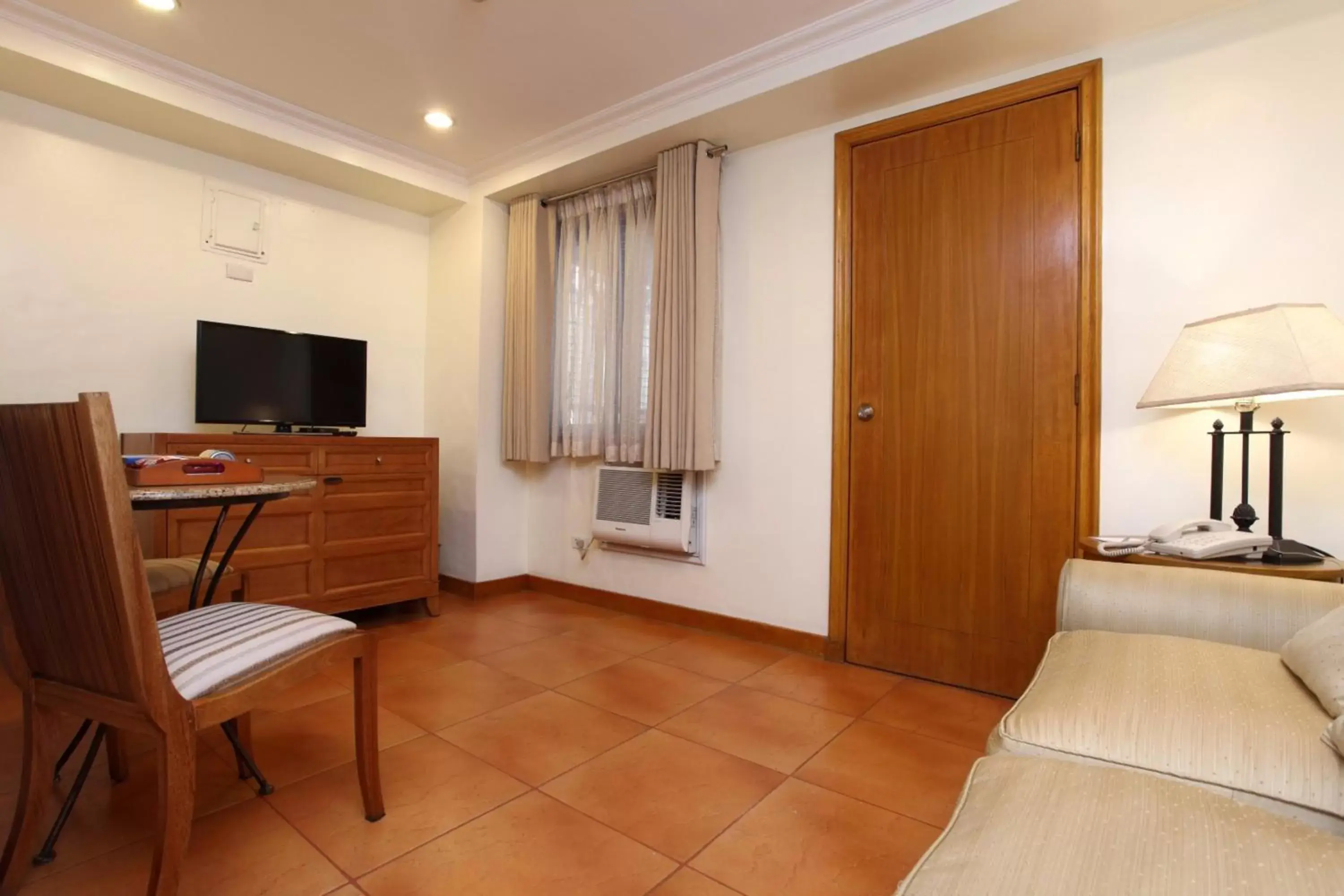 Bedroom, Seating Area in City Garden Suites