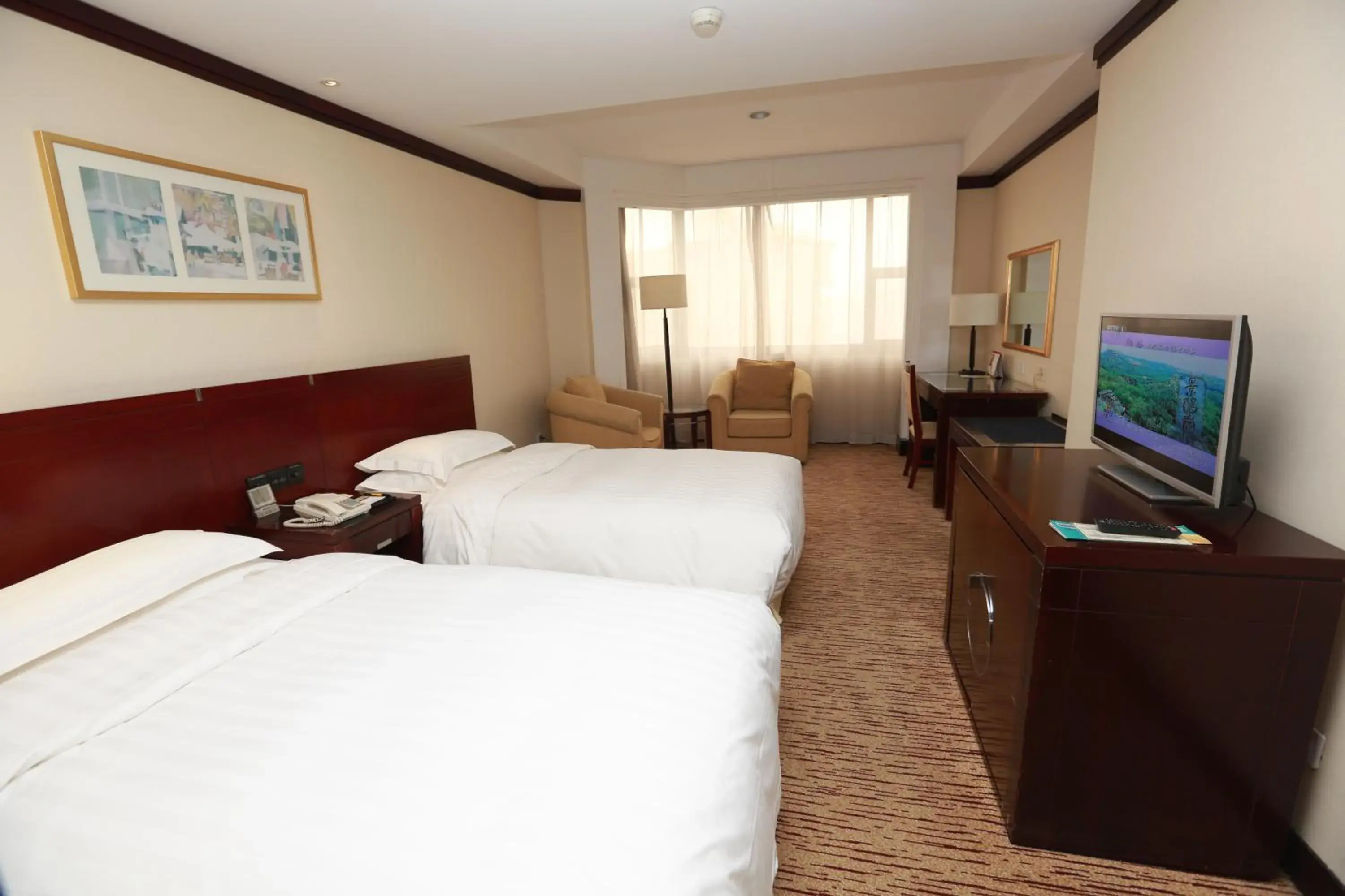 Bedroom in Poly Plaza Hotel