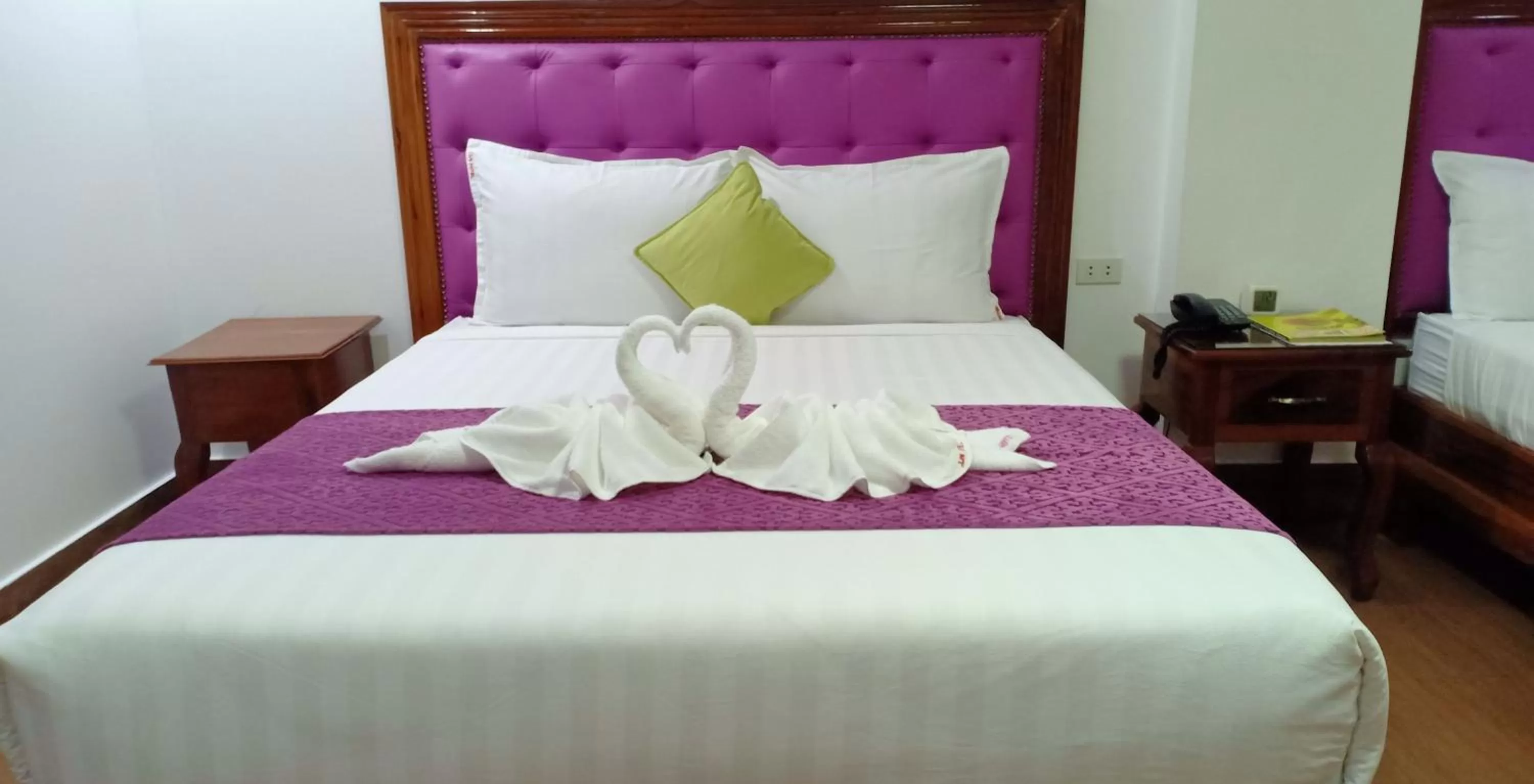 Bed in CLN Boutique Hotel