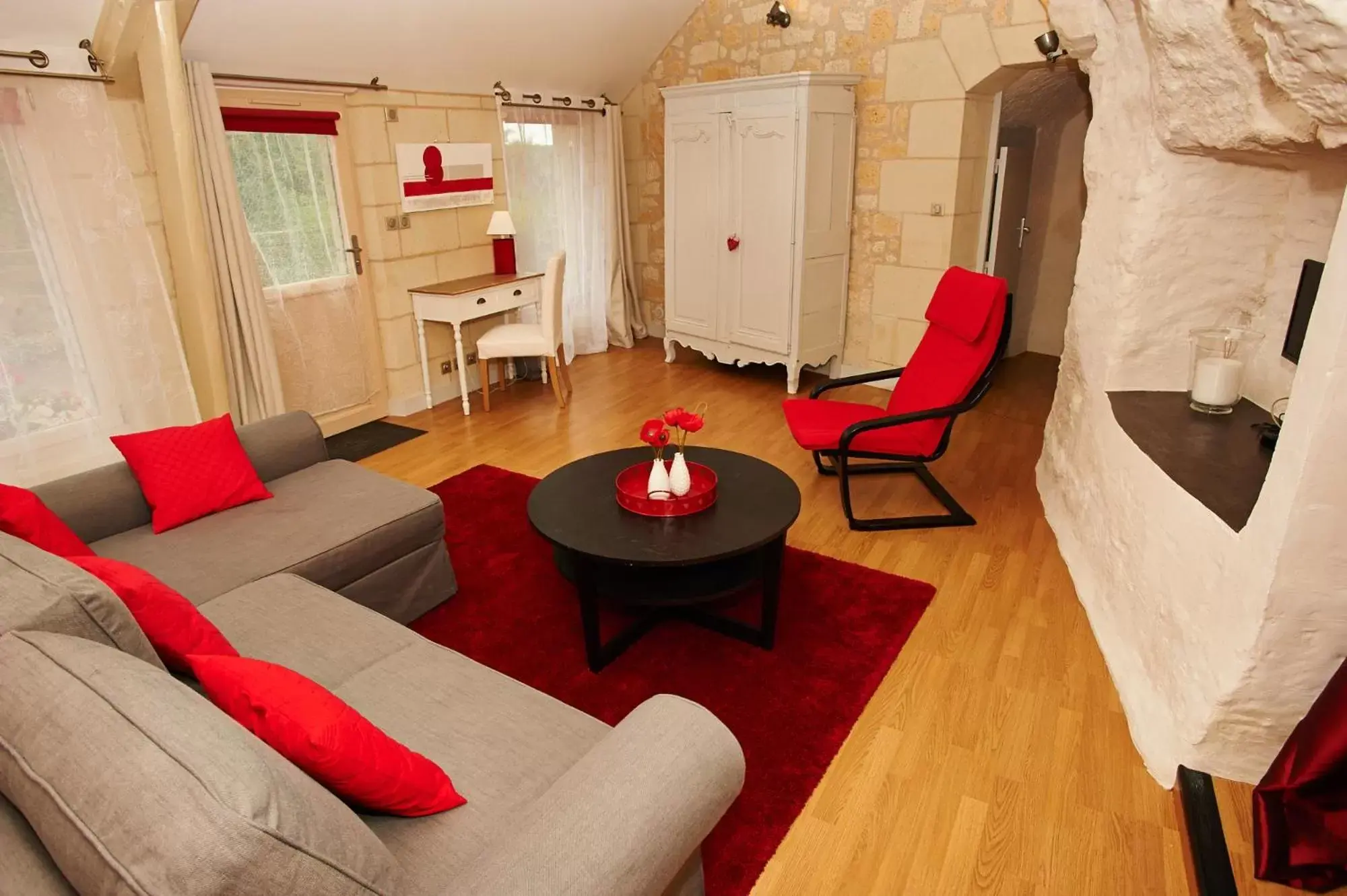 Communal lounge/ TV room, Seating Area in Logis Hôtels Troglododo