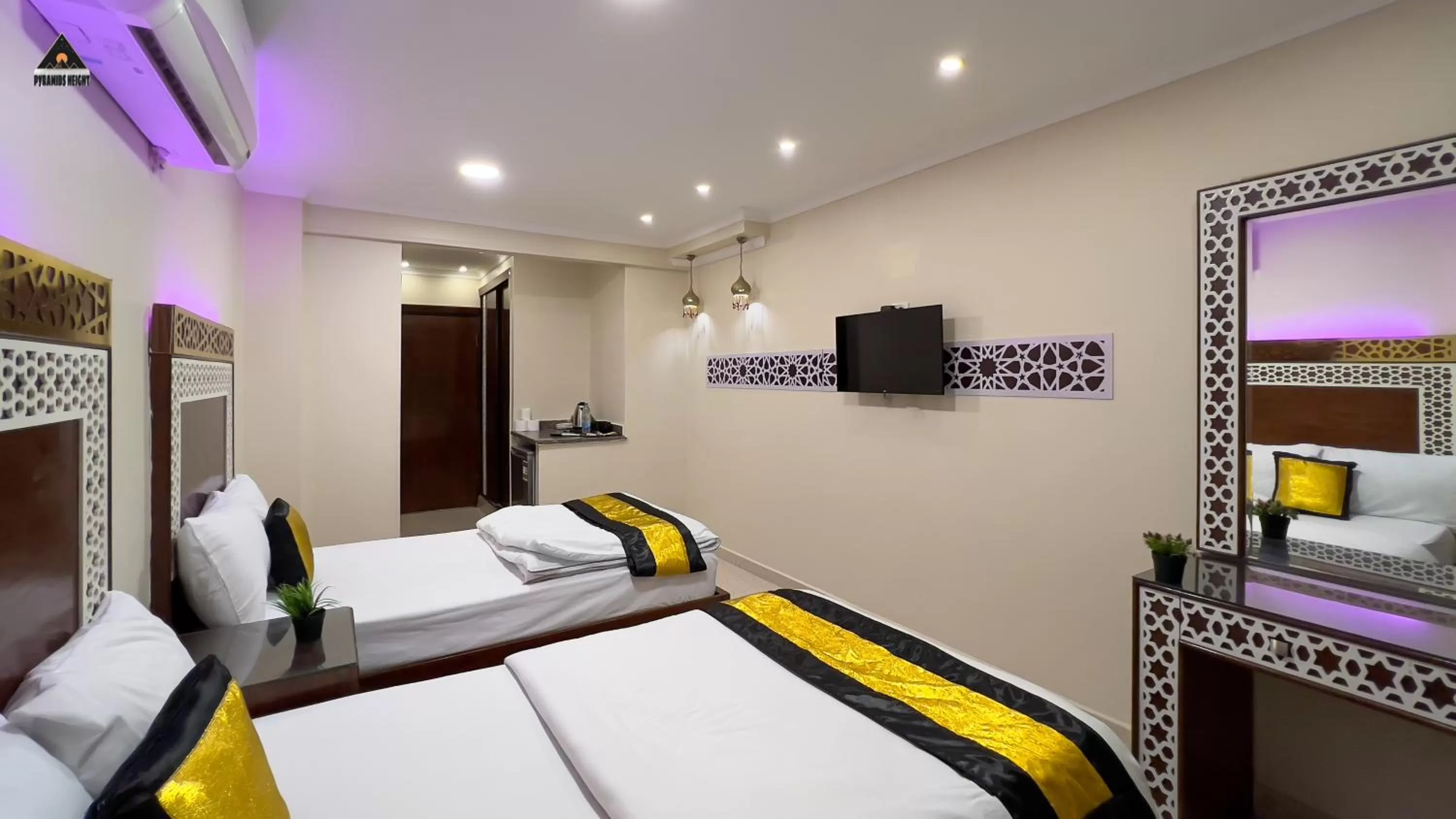 Bed in Pyramids Height Hotel & Pyramids Master Scene Rooftop