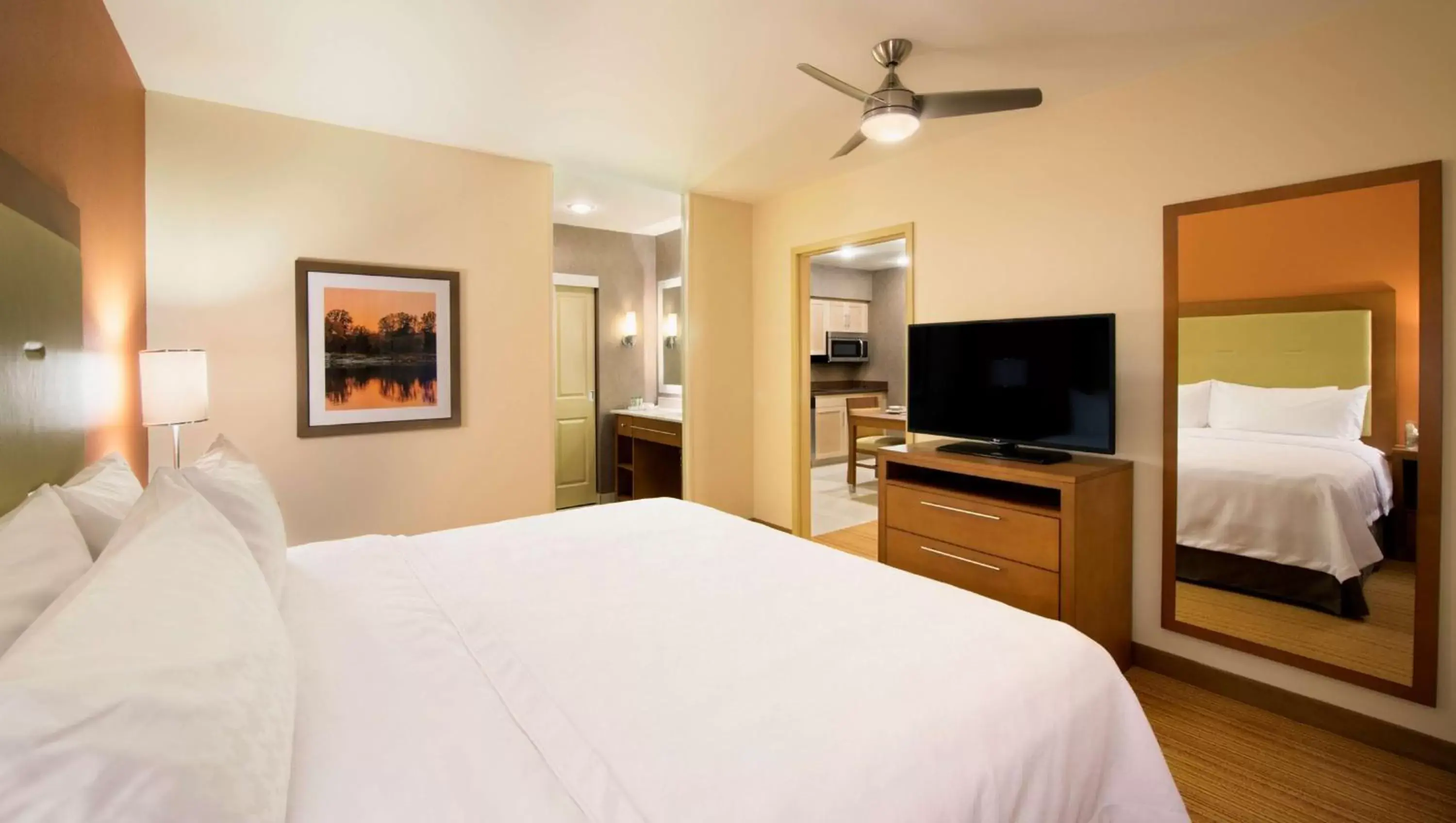 Living room, Bed in Homewood Suites by Hilton Winnipeg Airport - Polo Park