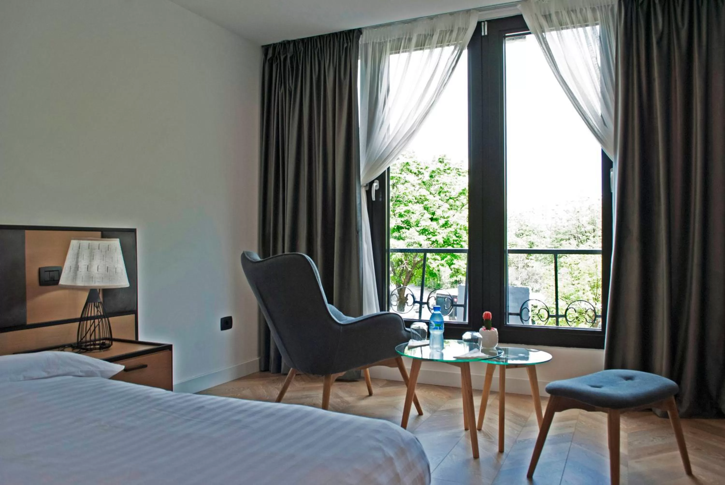 Seating area, Bed in Prime Hotel