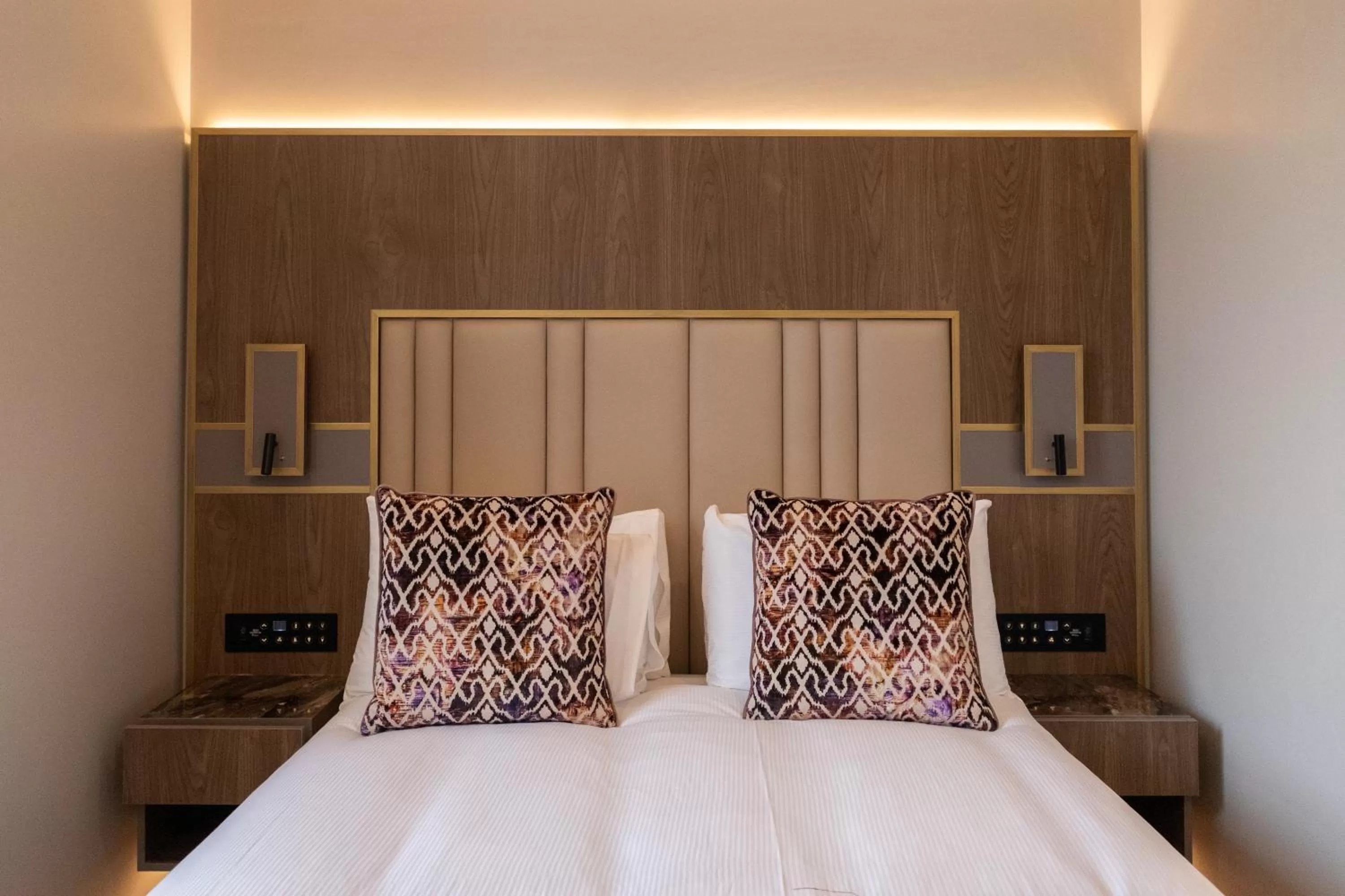 Bed in Merit Kensington Hotel