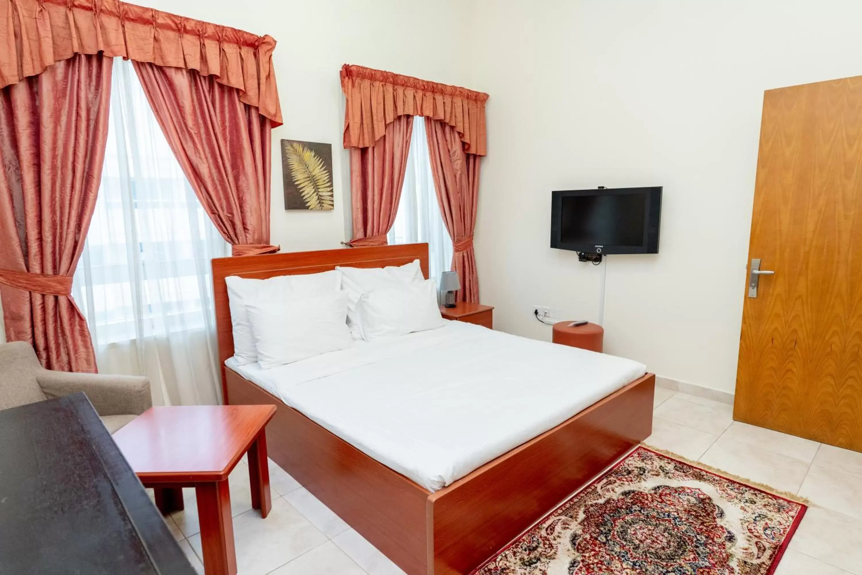 Bedroom, Bed in Al Raya Hotel Apartments