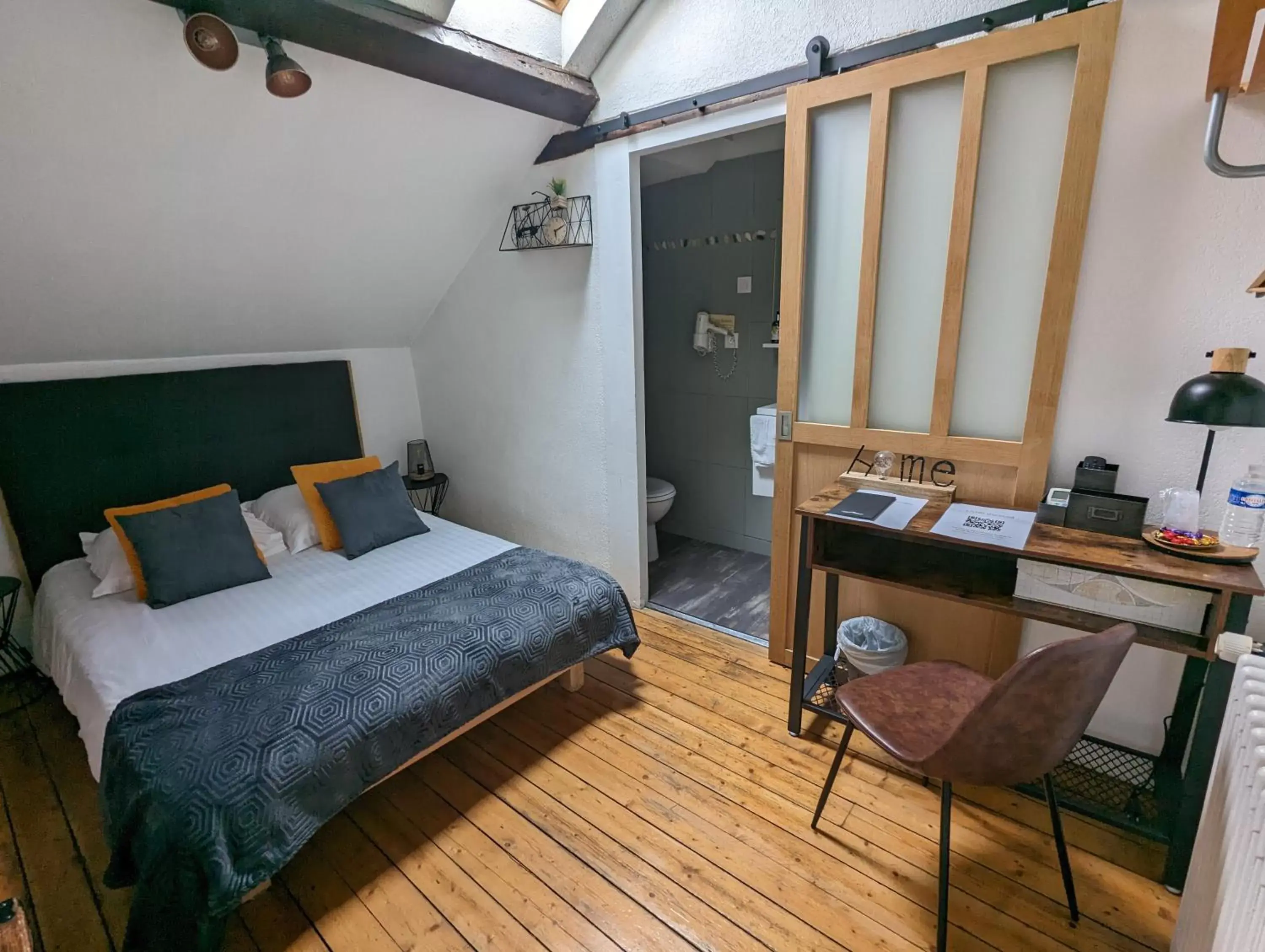 Photo of the whole room, Bed in Logis Hotel La Tourelle du Beffroi