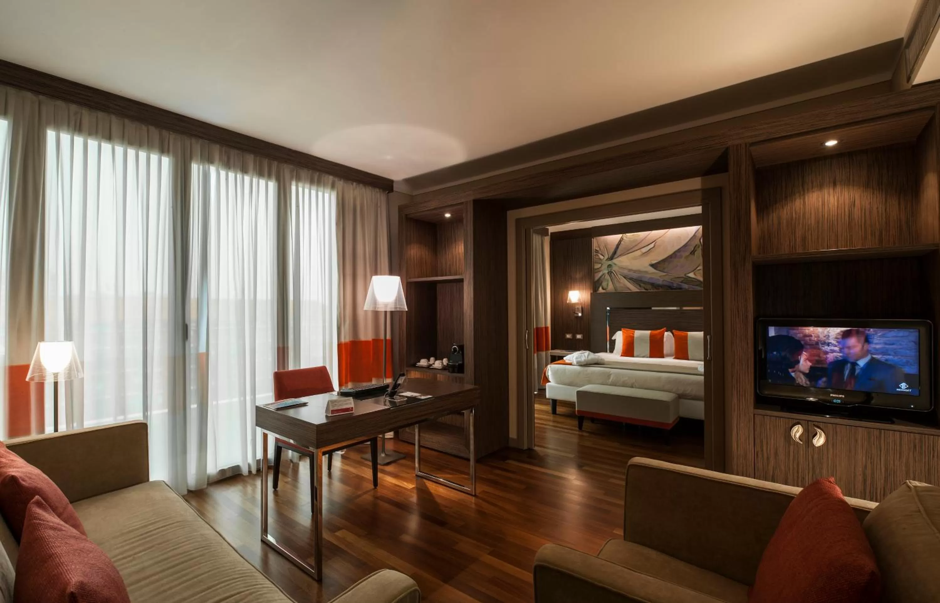 Living room, Bed in Ramada Plaza by Wyndham Milano